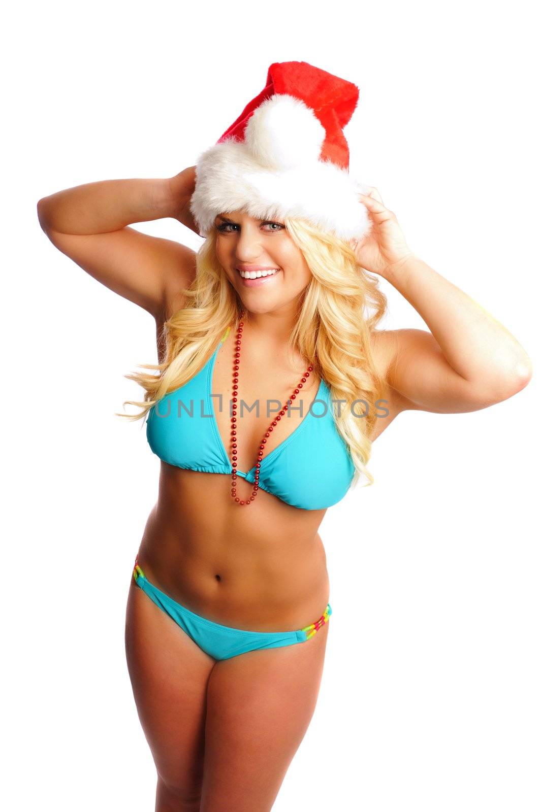 Attractive blonde woman in a bikini and santa hat on a white background