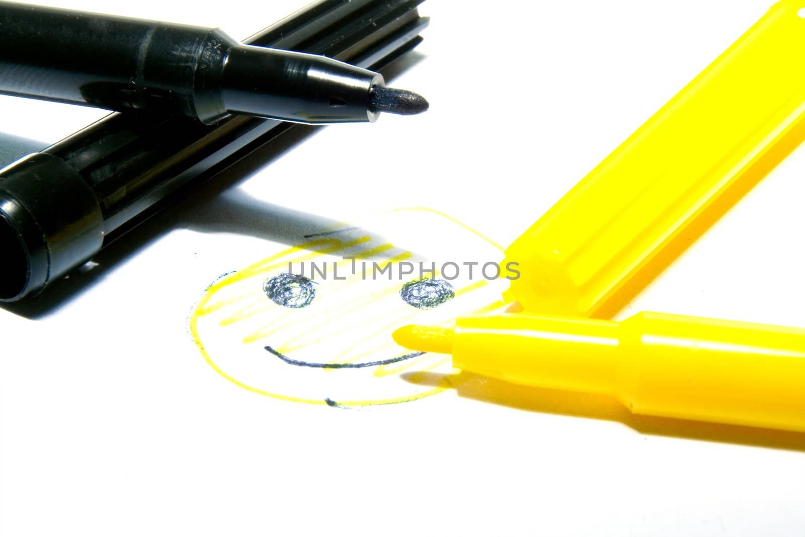 Color felt-tip pens photographed close up on a white background