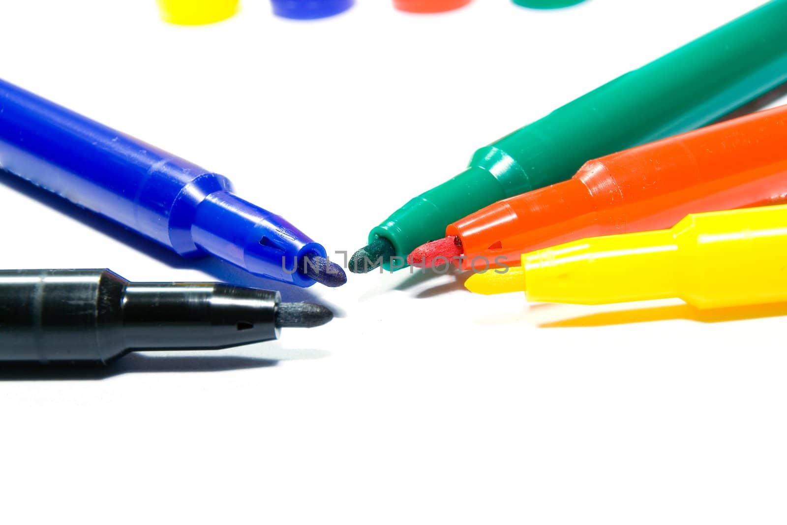 Color felt-tip pens photographed close up on a white background