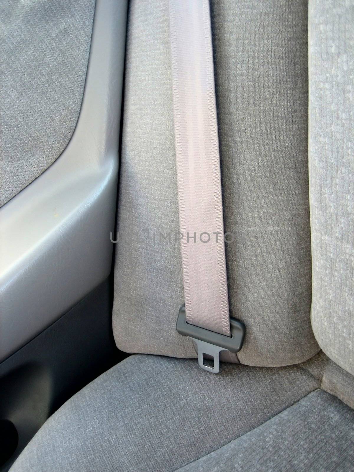 Picture of close ups of seat belts and other safety and restraining devices in cars