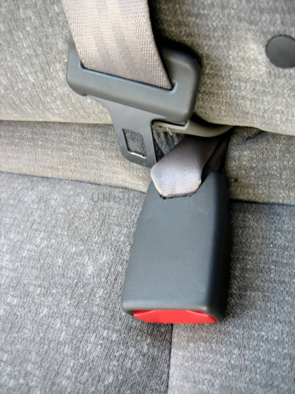 Picture of close ups of seat belts and other safety and restraining devices in cars