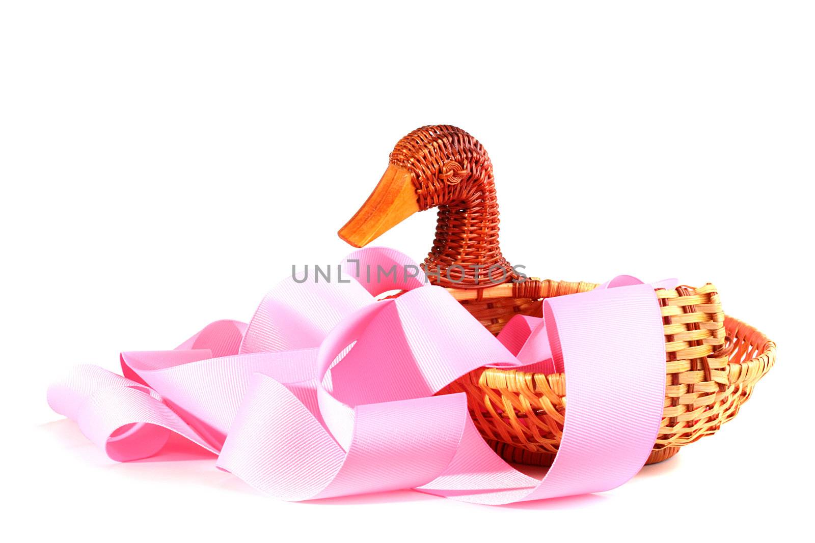Decorative basket executed in the form of a duck with a pink celebratory tape.