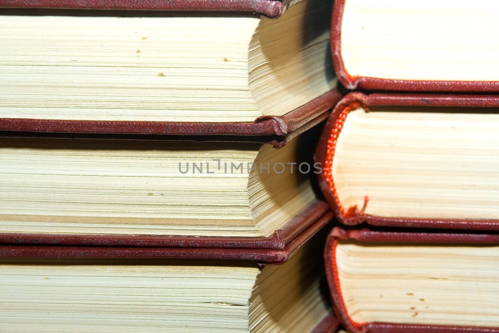 Old books in darkly red covers