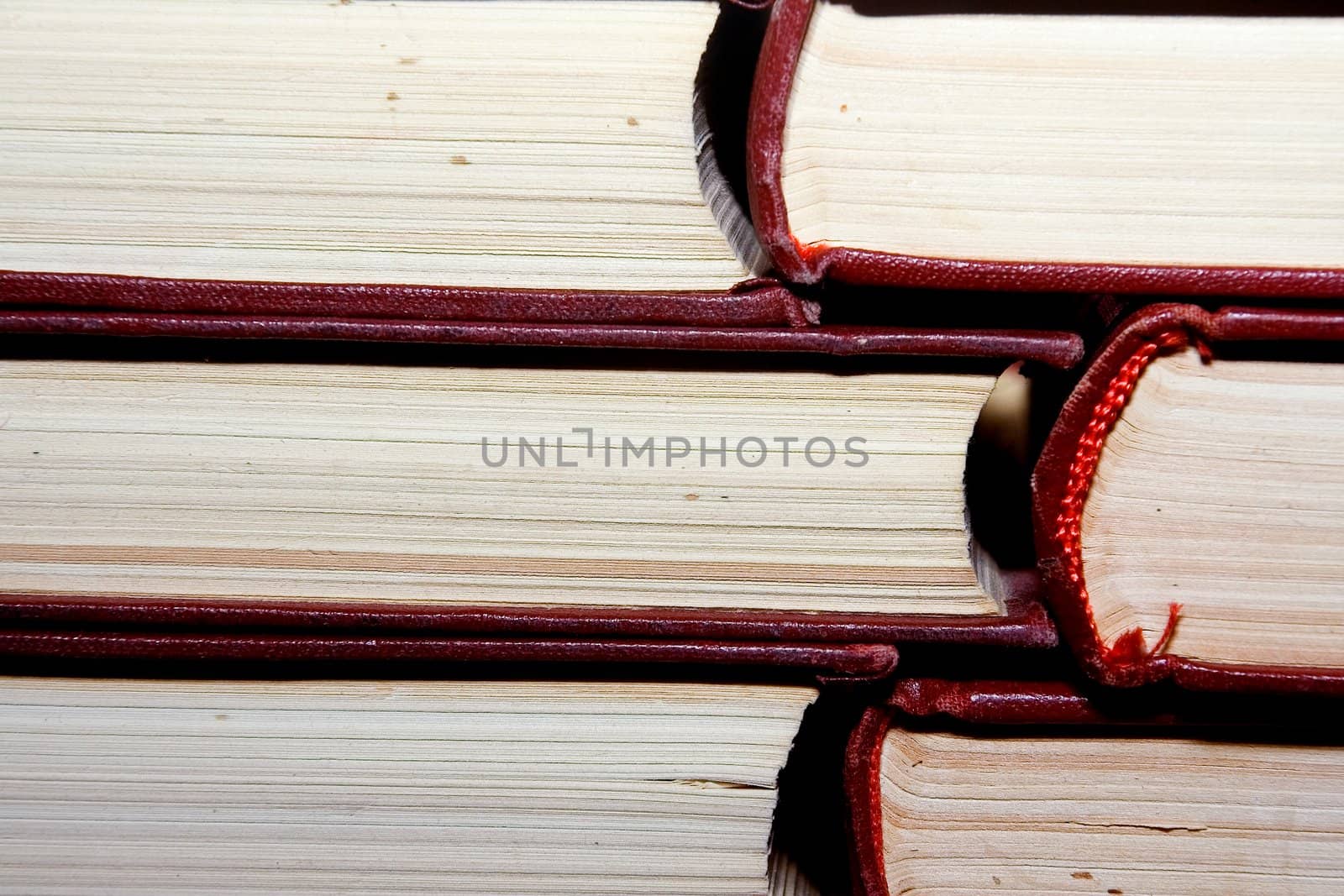 Old books in darkly red covers