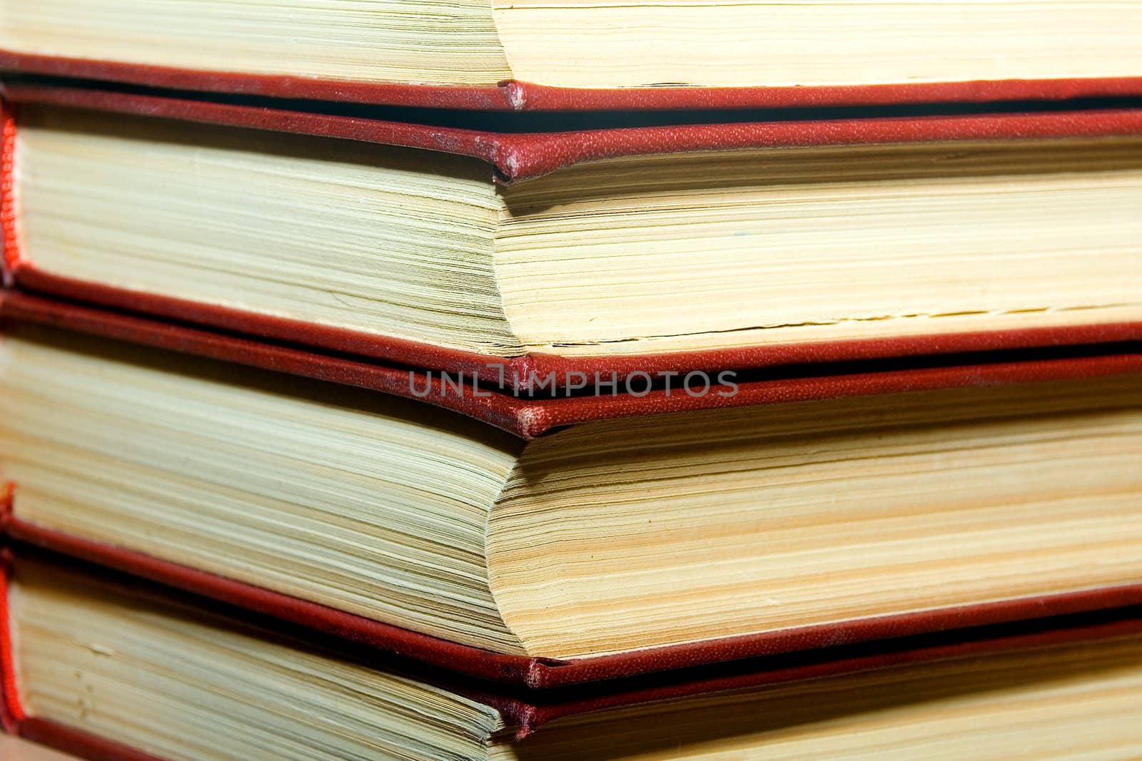 Old books in darkly red covers