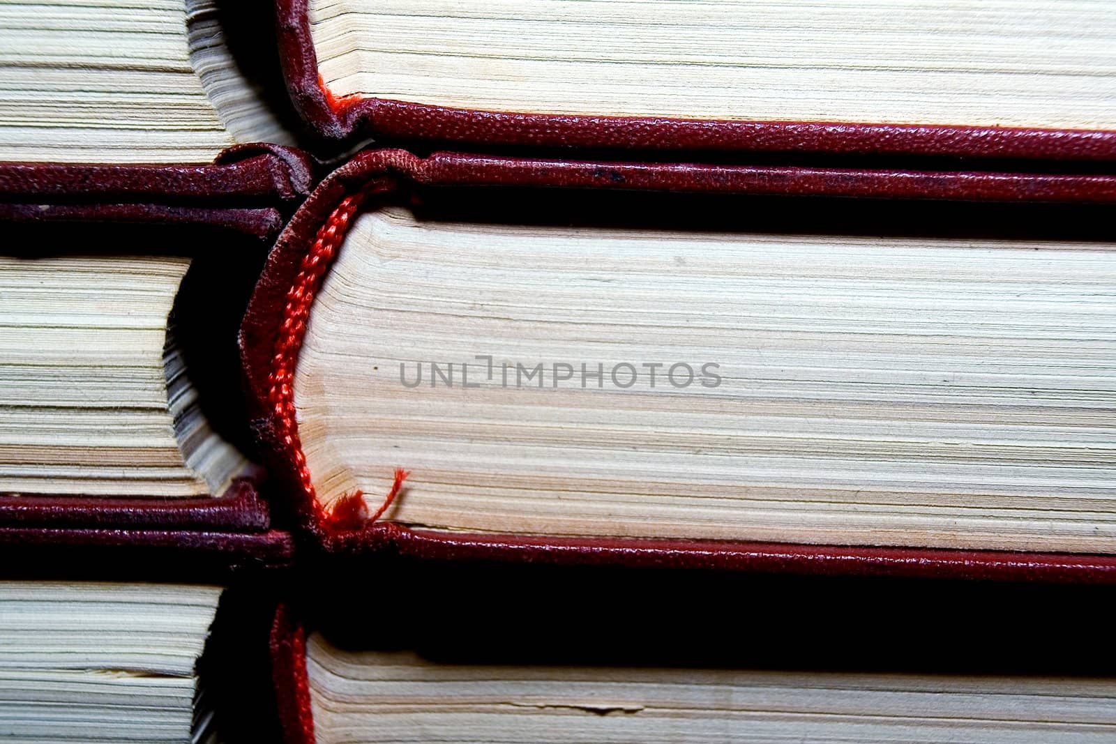 Old books in darkly red covers