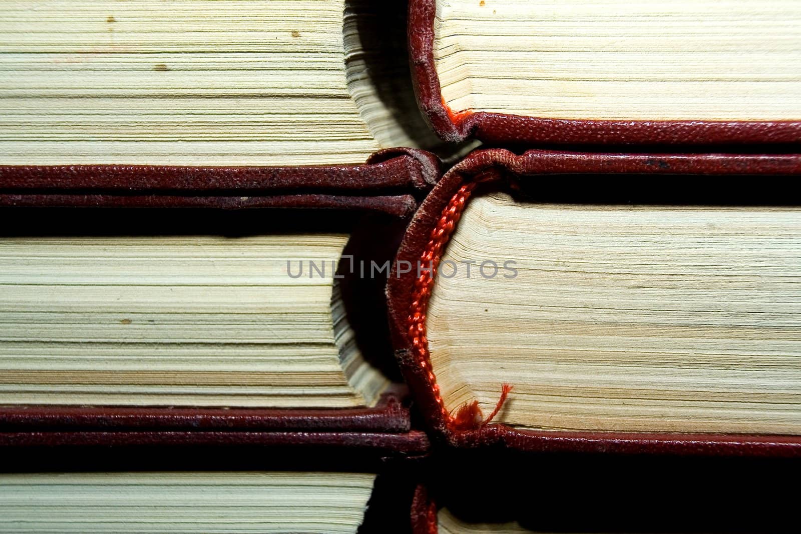 Old books in darkly red covers