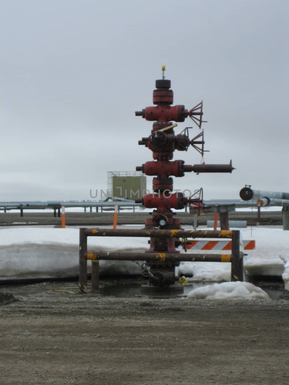 Oil and petroleum extraction site including drilling wells and pipeline for transportation of crude oil