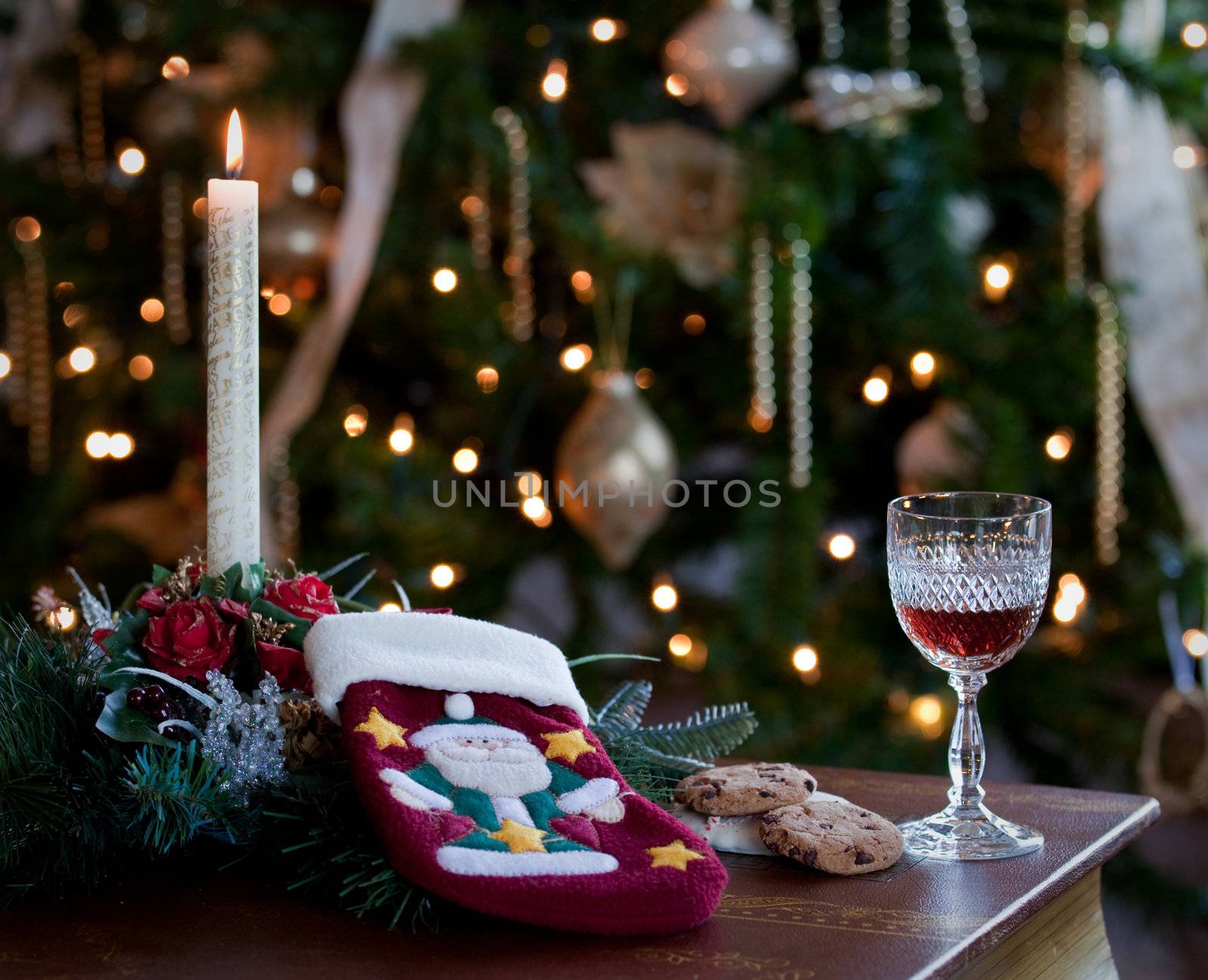 Glass of sherry or wine with cookies and embroidered stocking for gifts