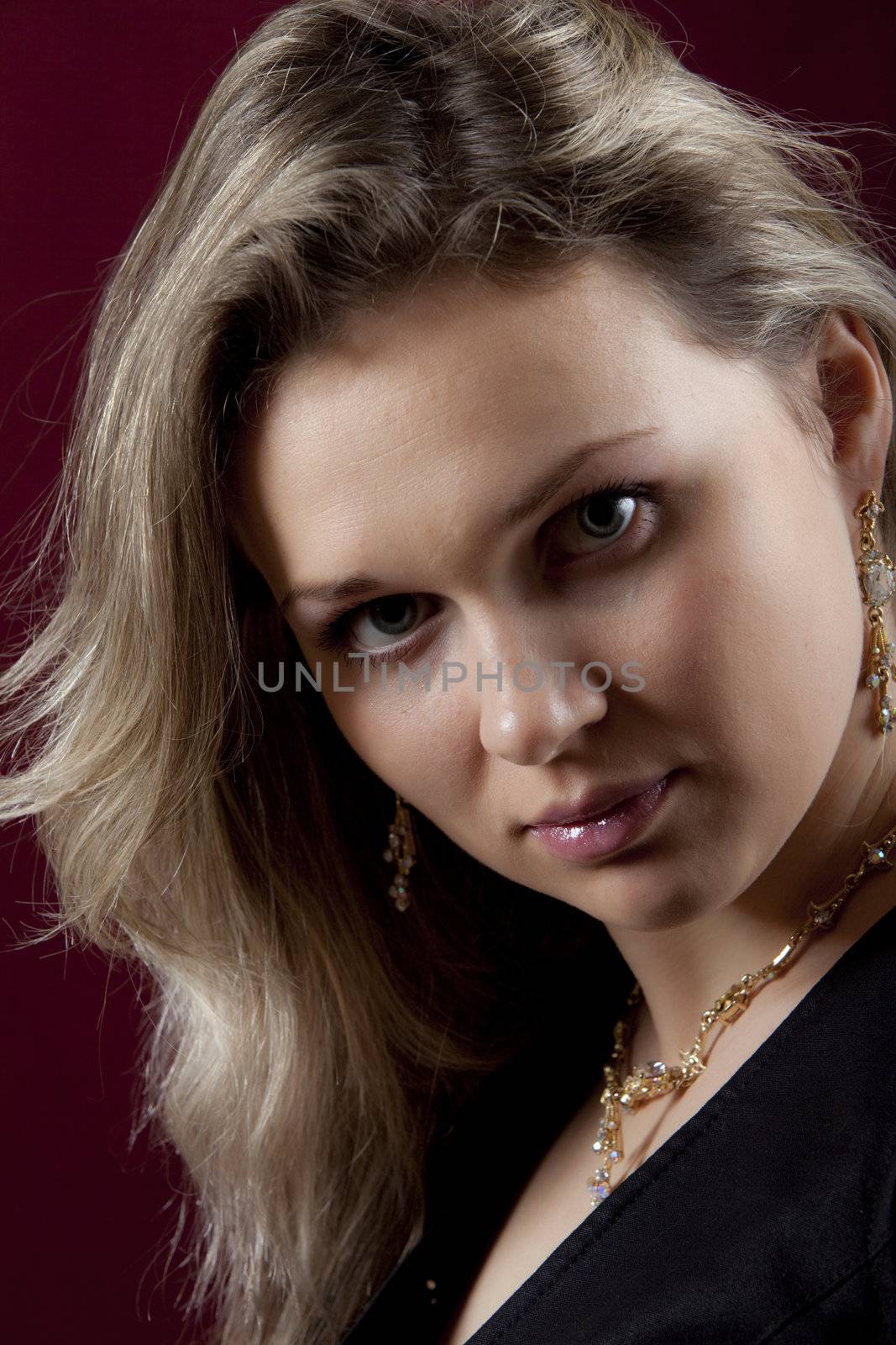 Portrait young sexual girl on red background