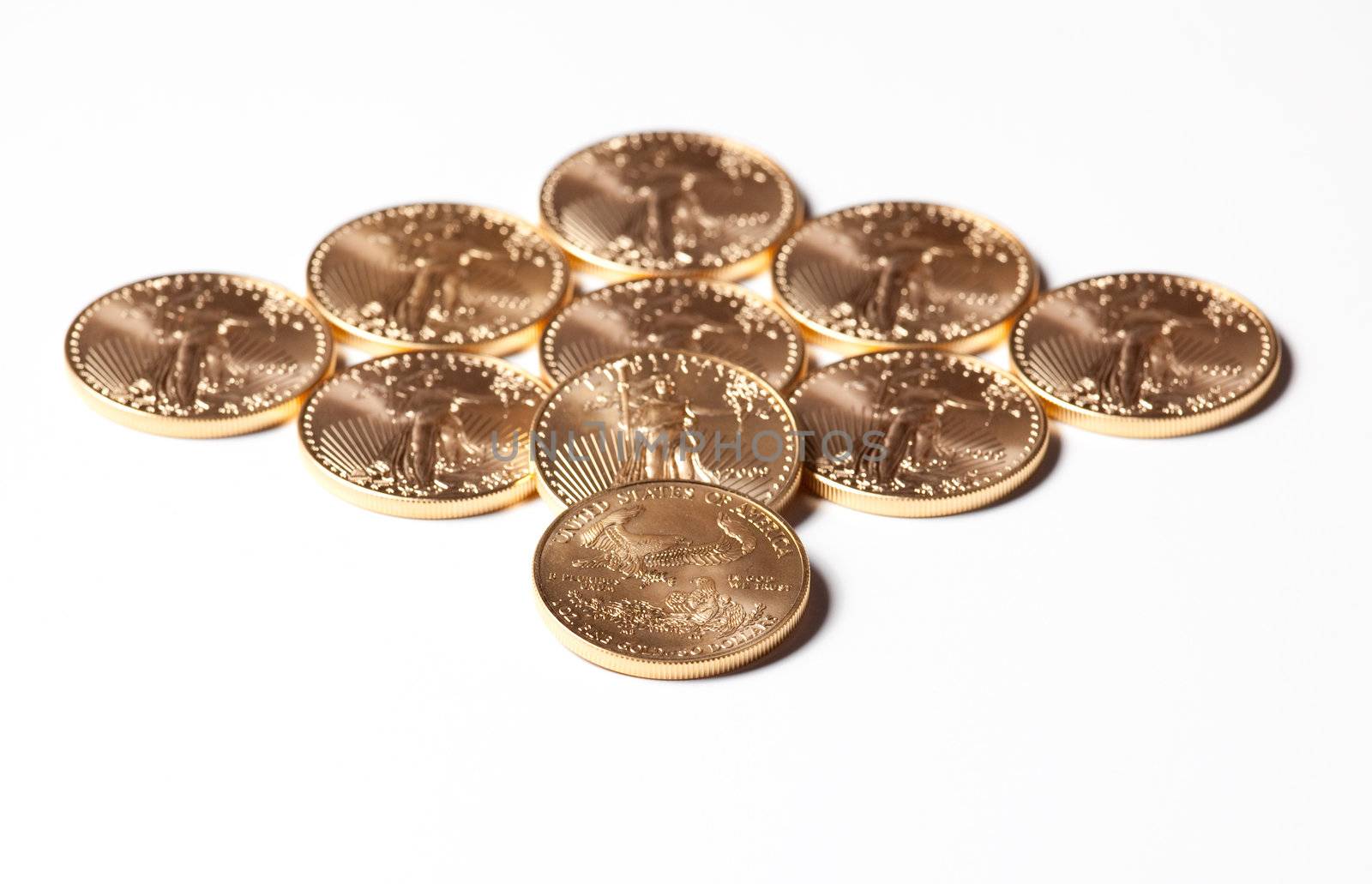 Solid gold eagle coins in the shape of a diamond