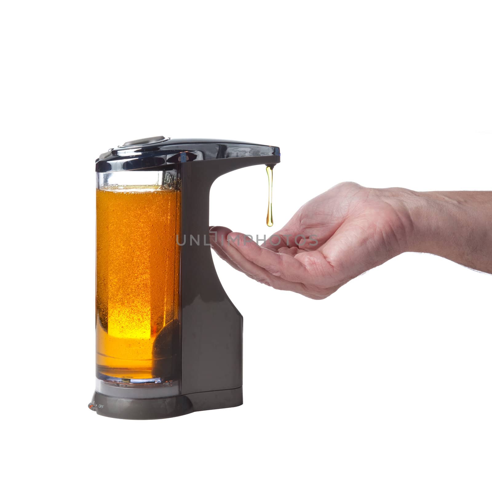 Soap or detergent being dispensed into male hand prior to hand washing