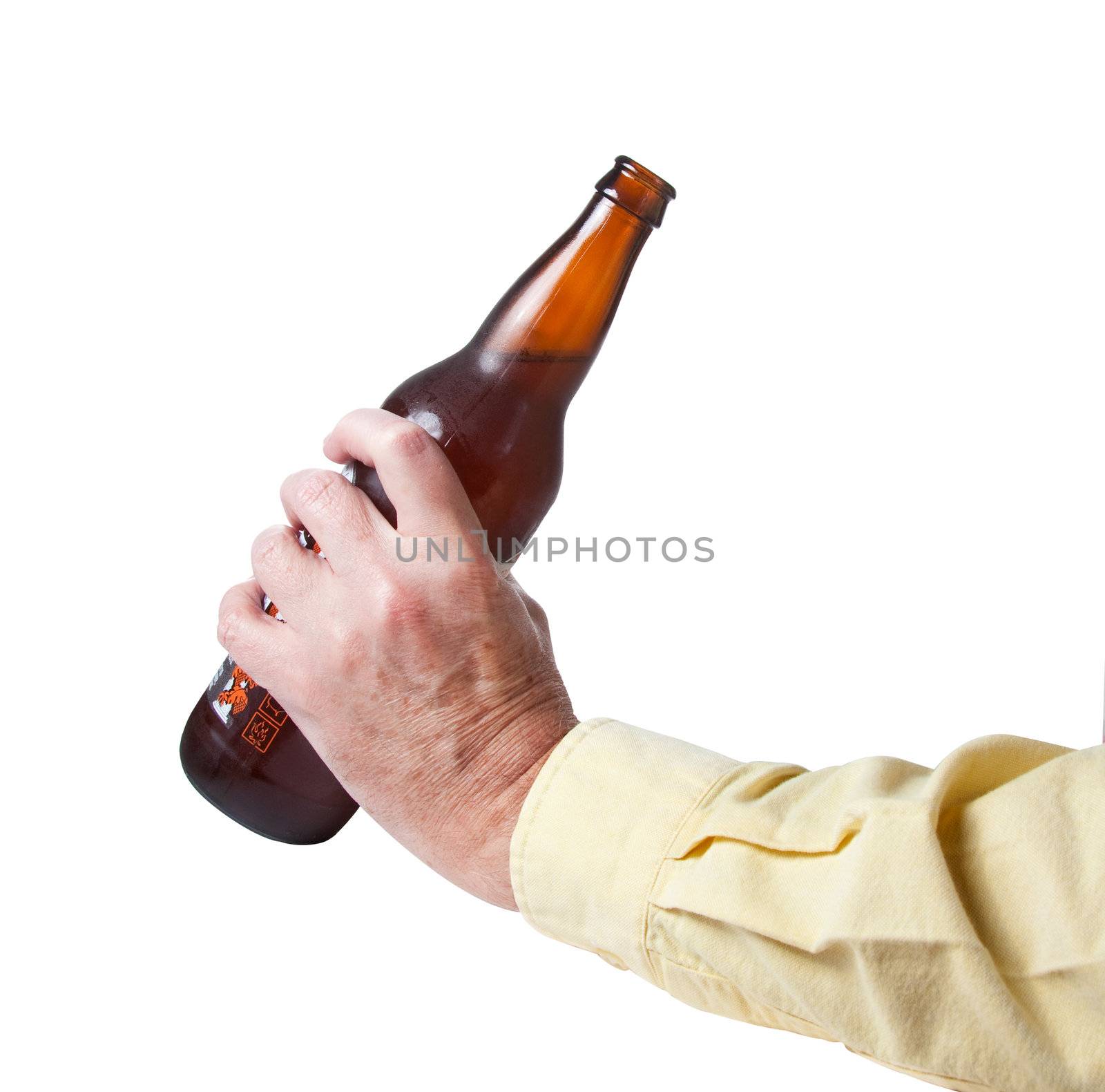 Brown bottle of beer in old hand by steheap