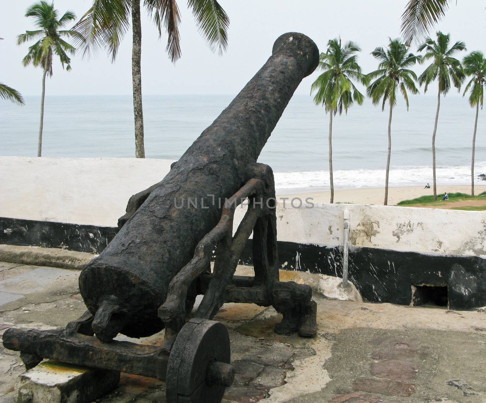 Rusty cannon on Elmina Fort in Ghana by steheap