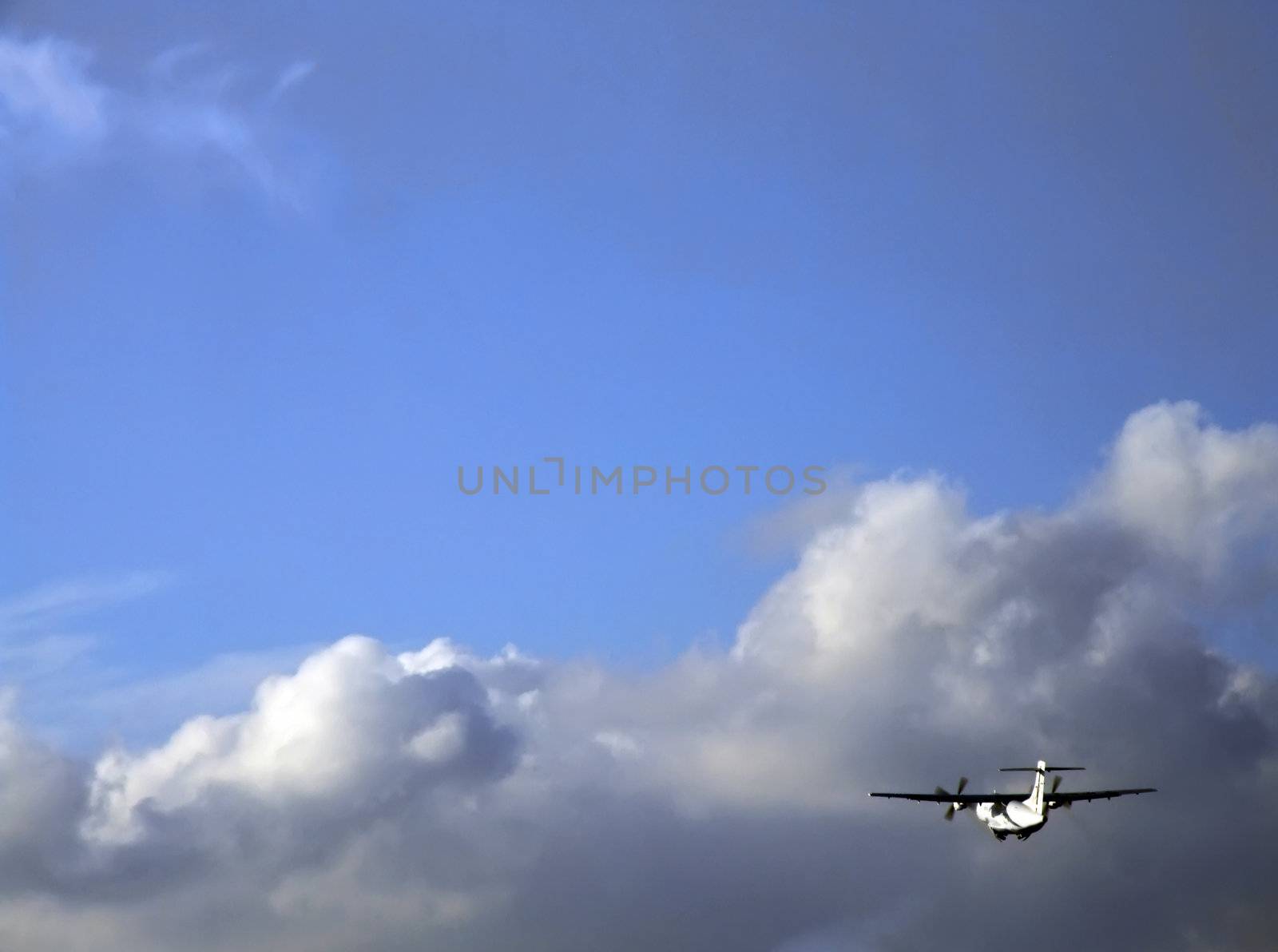 Civil aircraft taking off heading into the clouds