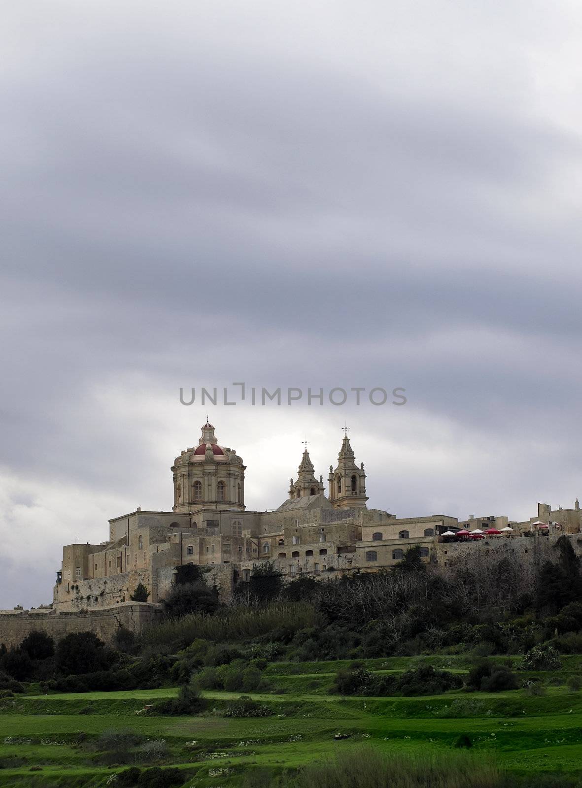 The dome of the medieval cathedral overlooking the bastions of the old city of Malta, Mdina.