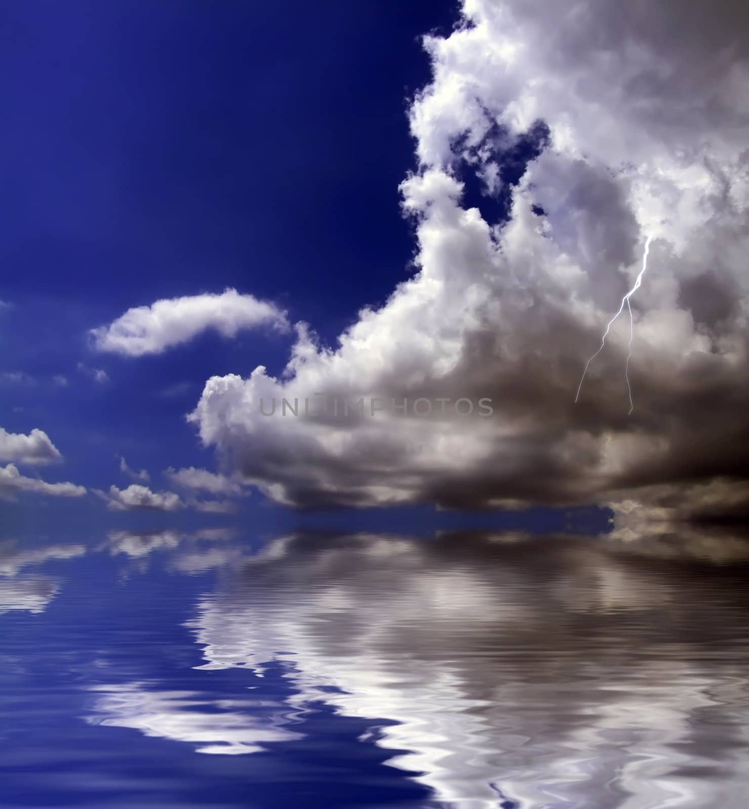 Clouds looming over the horizon with deep blue sky in background