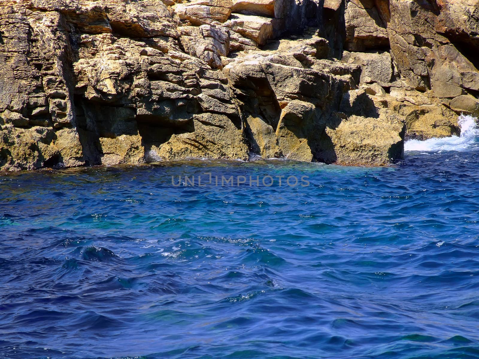 Typical rocky coastline in Malta, punctuated with sheer drops and jagged cliffs