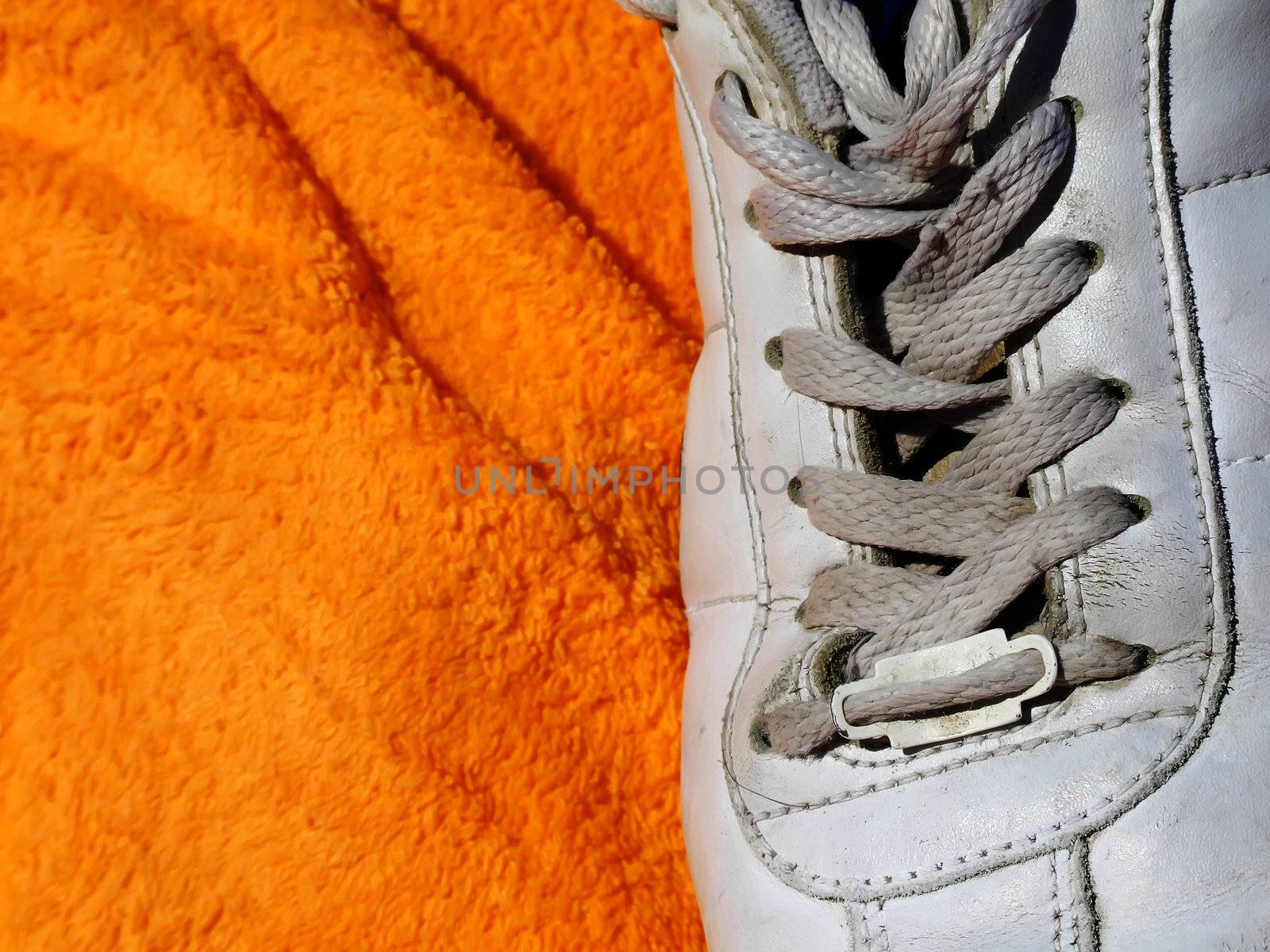 Detail shot of old worn out sneakers, depicting the sneaker culture