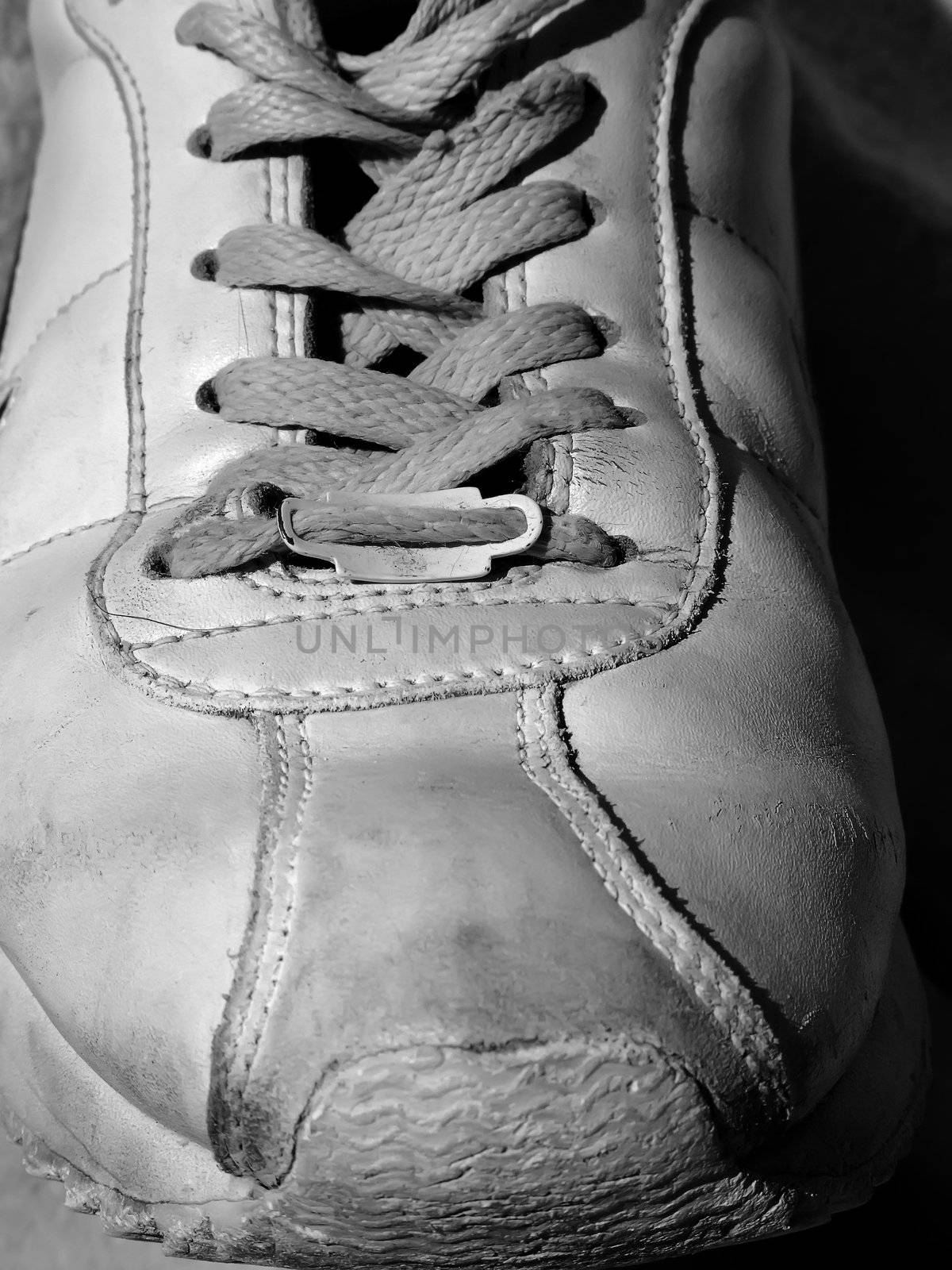 Detail shot of old worn out sneakers, depicting the sneaker culture