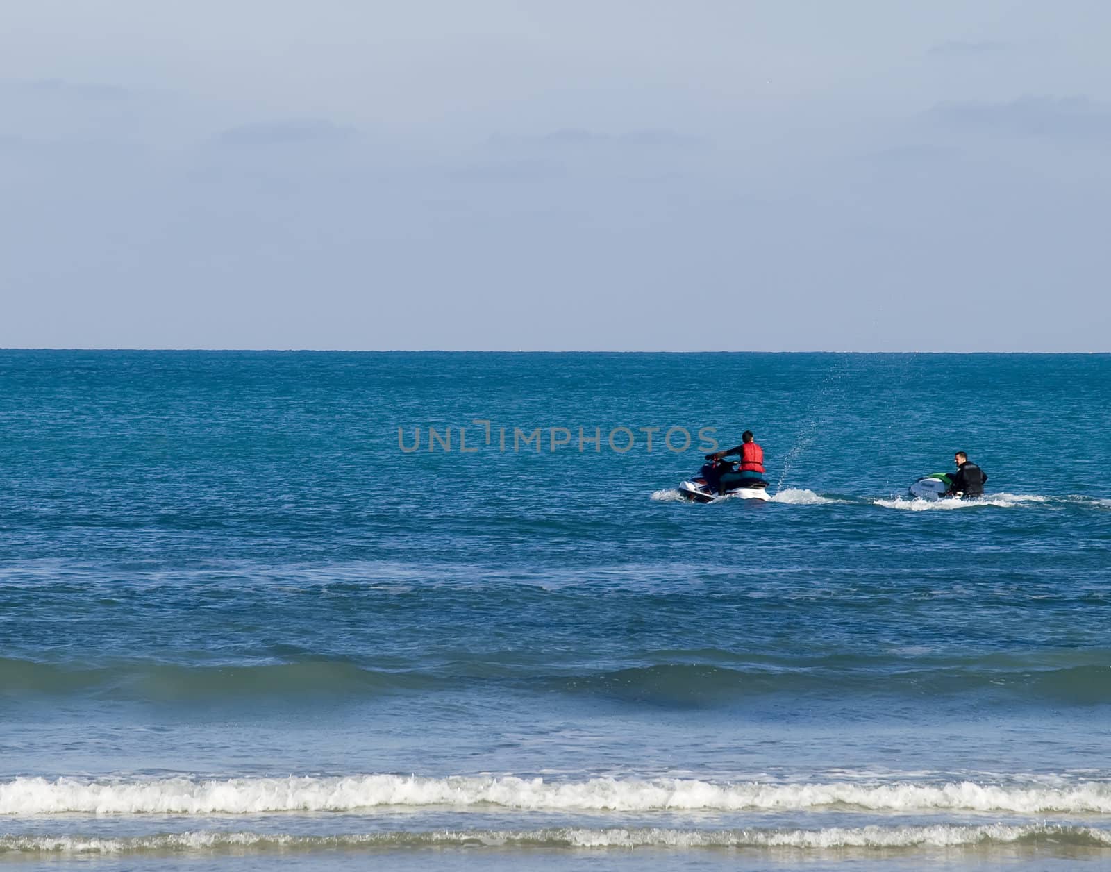 Jetski sport drivers having fun off the coast in Malta.