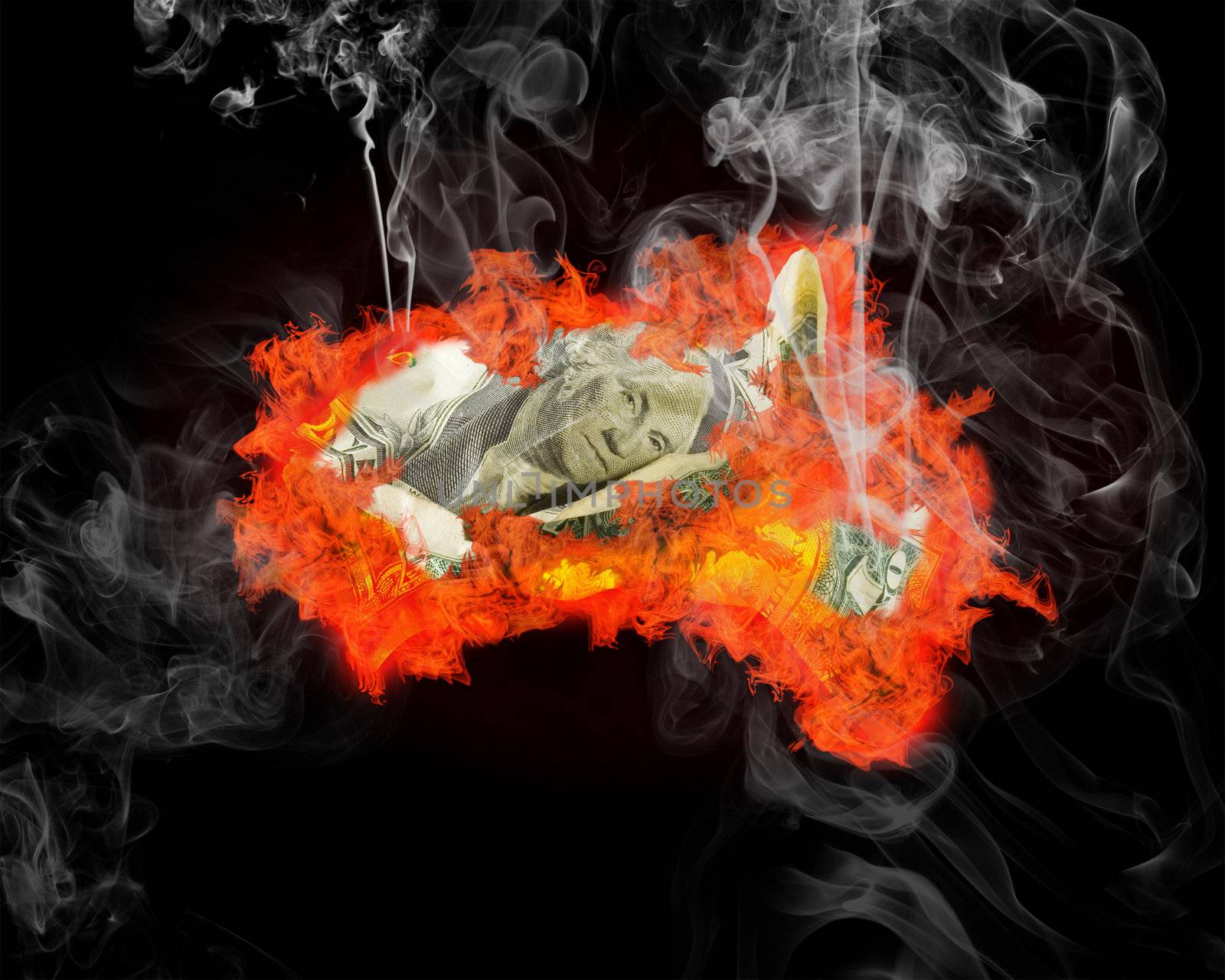 The burning and smoking dollar on a black background. Financial crisis. The unsuccessful investment. The burnt down savings.

