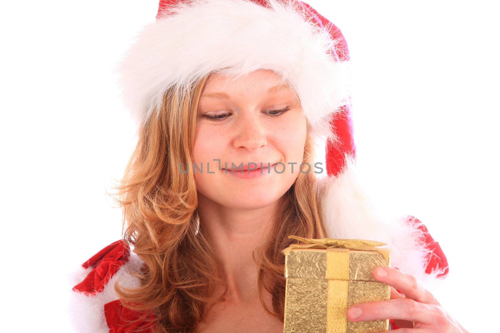 miss santa is smiling at a golden gift box in her hand