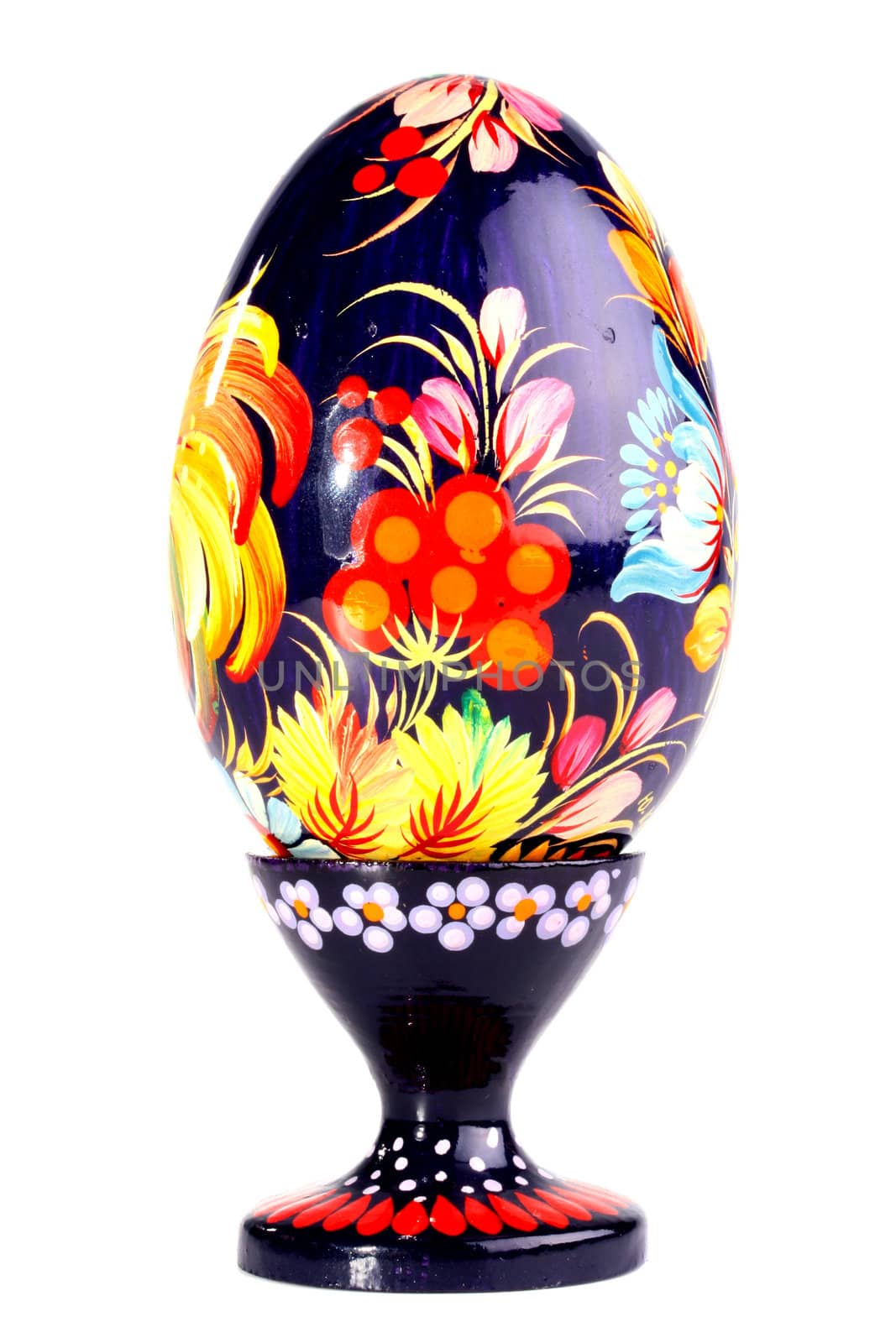 Wooden painted egg in style of Russian varnish list on a support. On egg flowers a symbol of the Russian village are drawn.