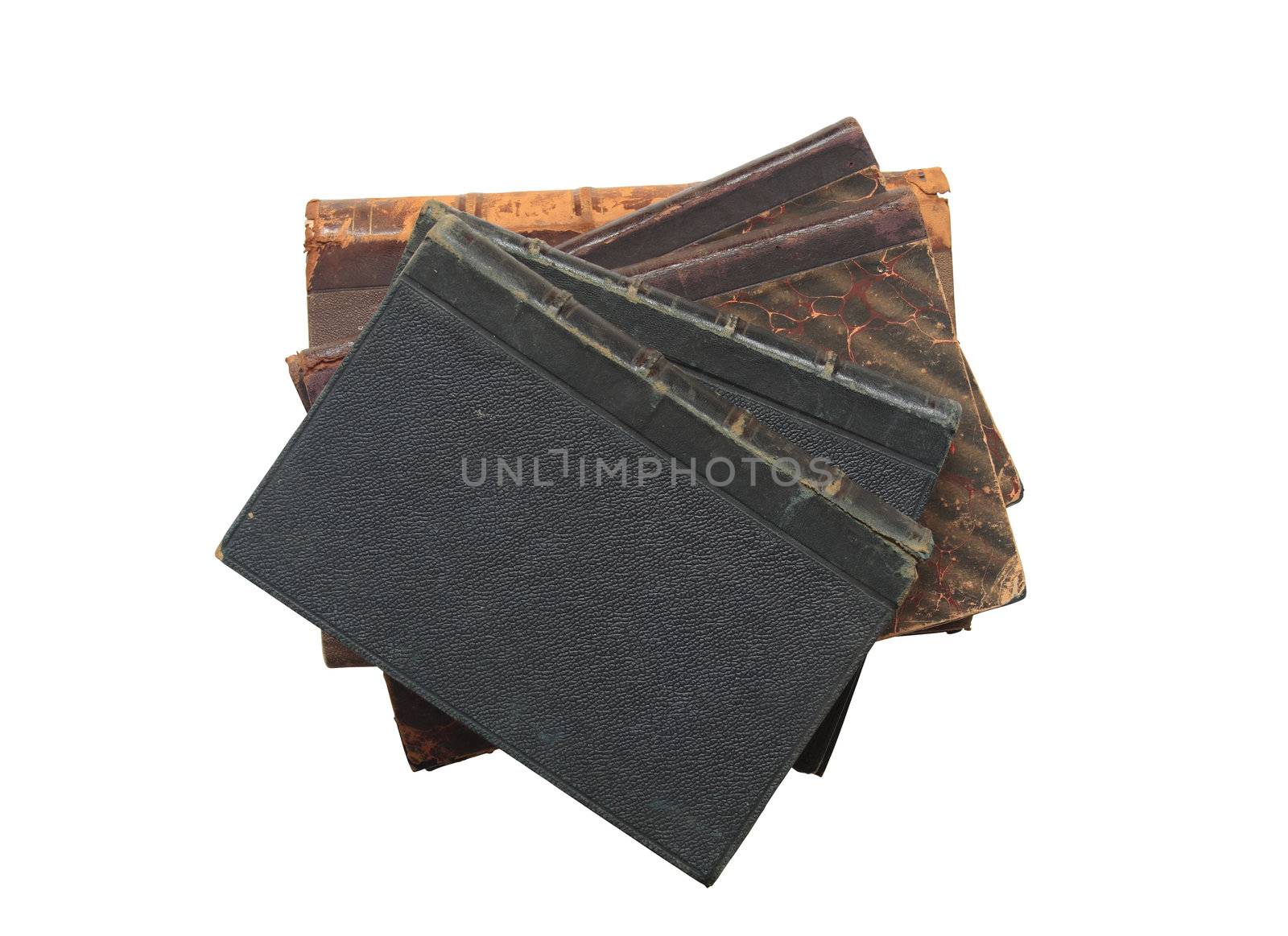 Stack of ancient books lying on white background isolated with clipping path