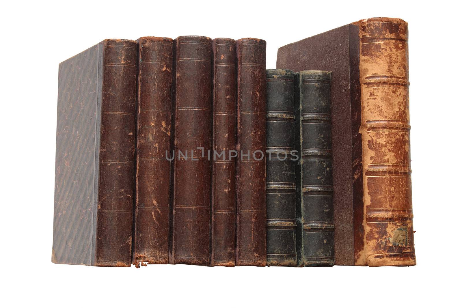 Few ancient books standing in a row isolated on white background with clipping path