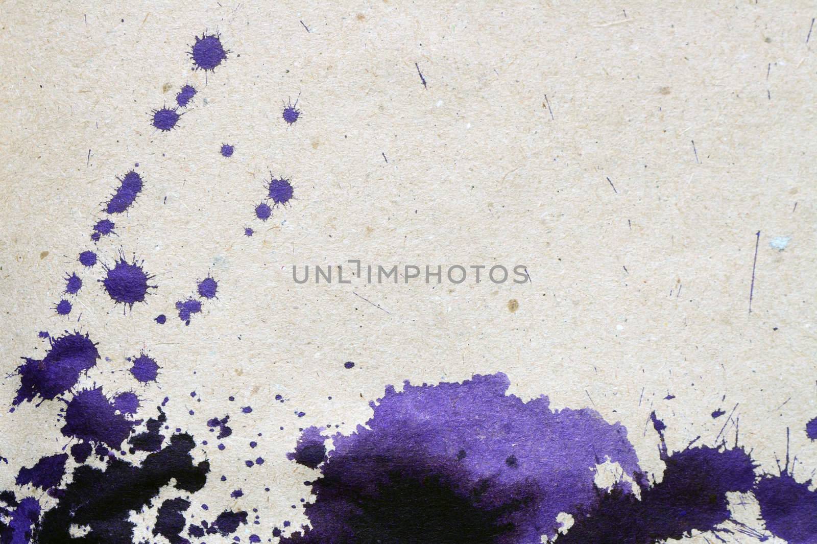 Background made from rough paper with violet ink blots