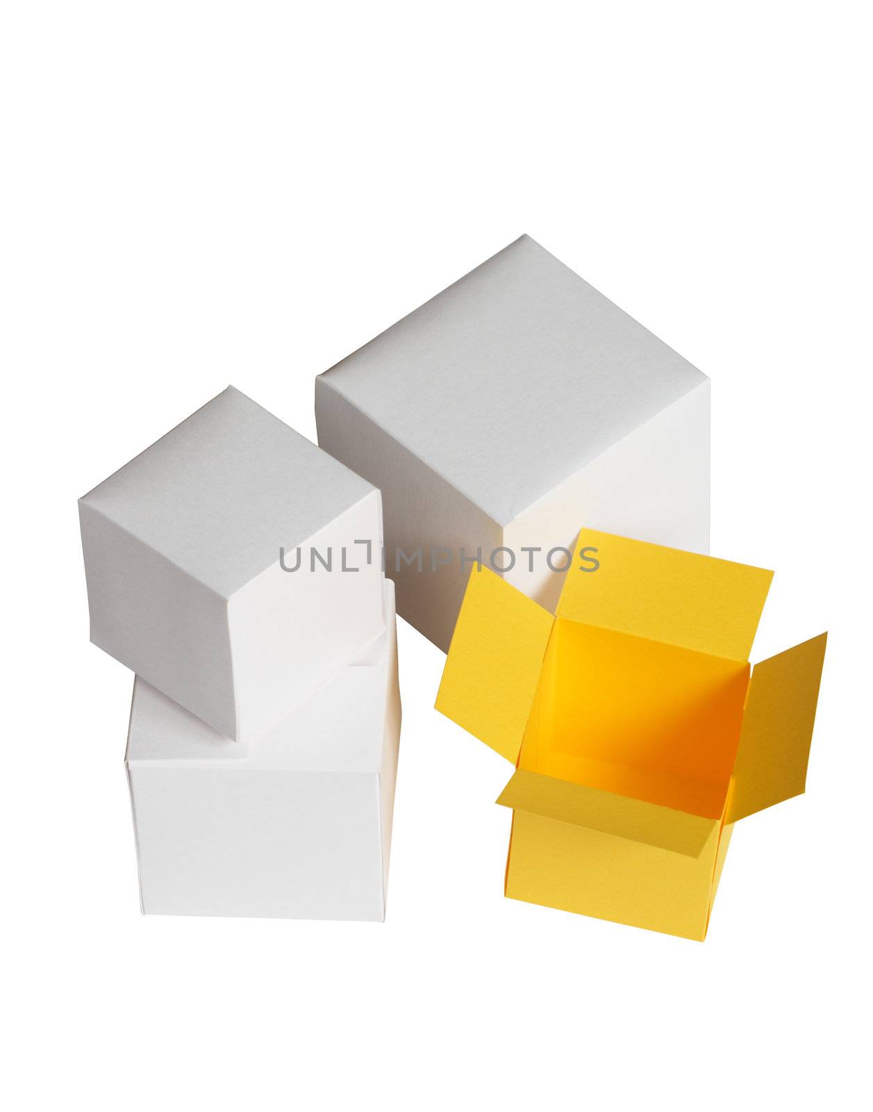 One open yellow paper box near three closed white boxes. Isolated with clipping path