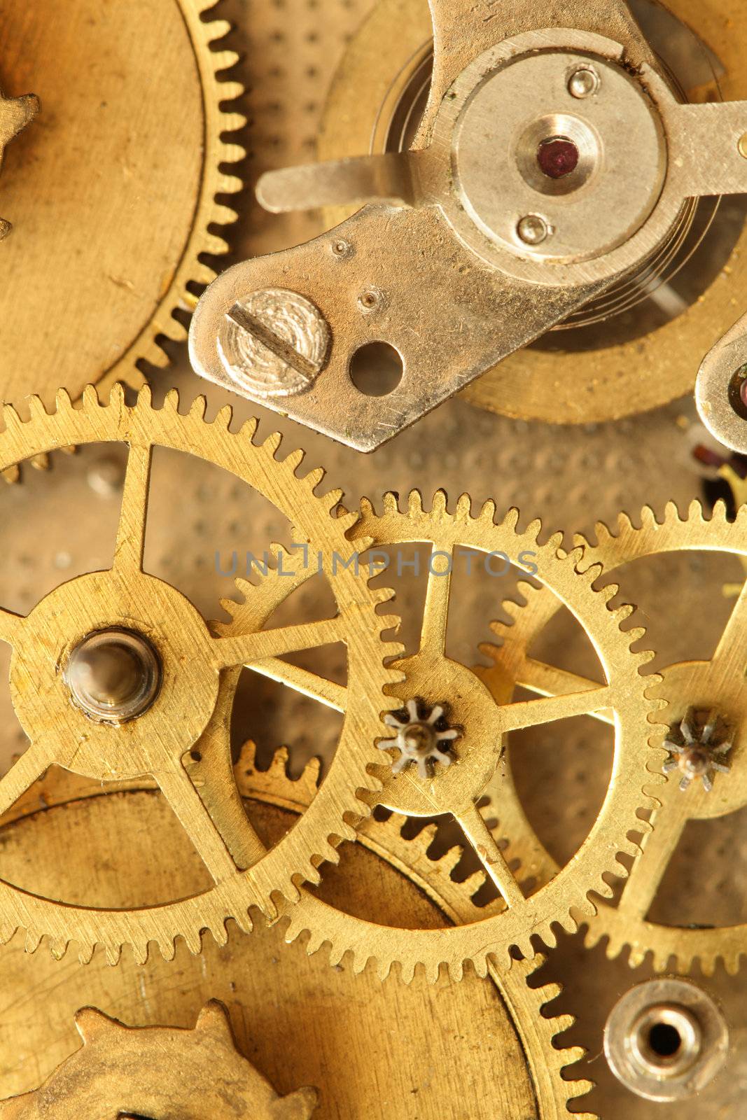 Closeup of vintage brass clock mechanism. Conceptual background