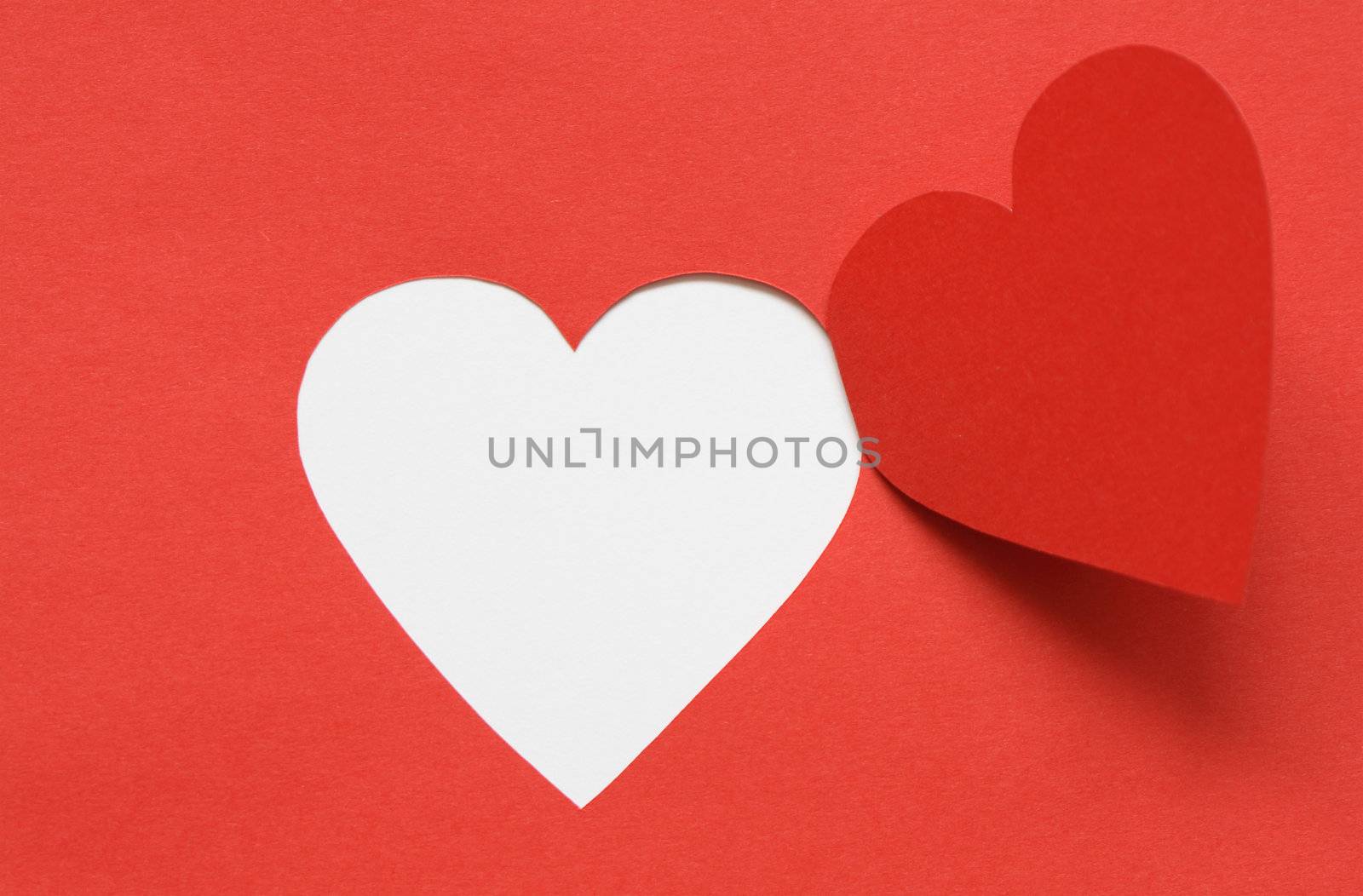 Red paper background with cutting heart. Image with clipping path for your design ideas