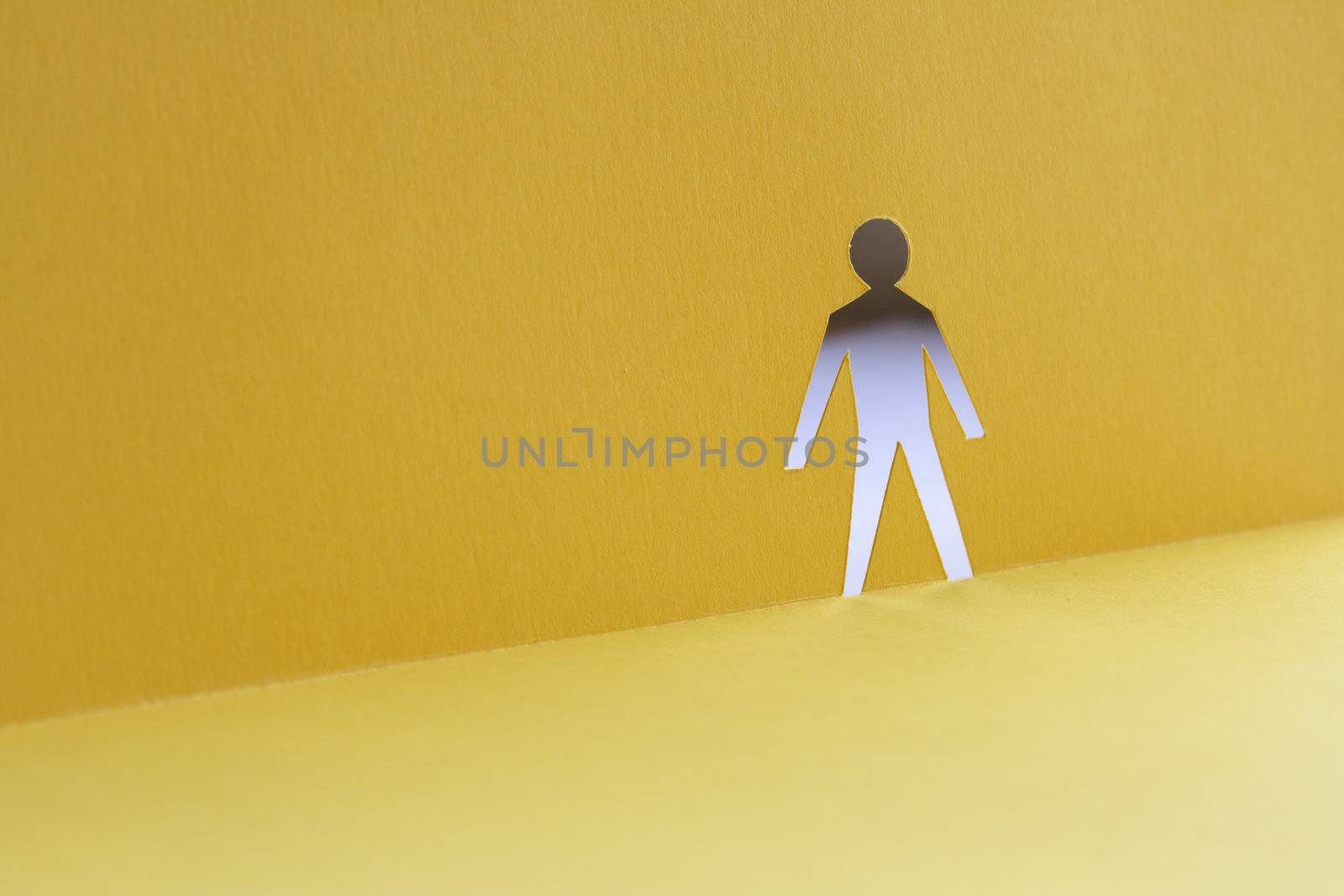 Abstrack background with man figure cutting from yellow paper