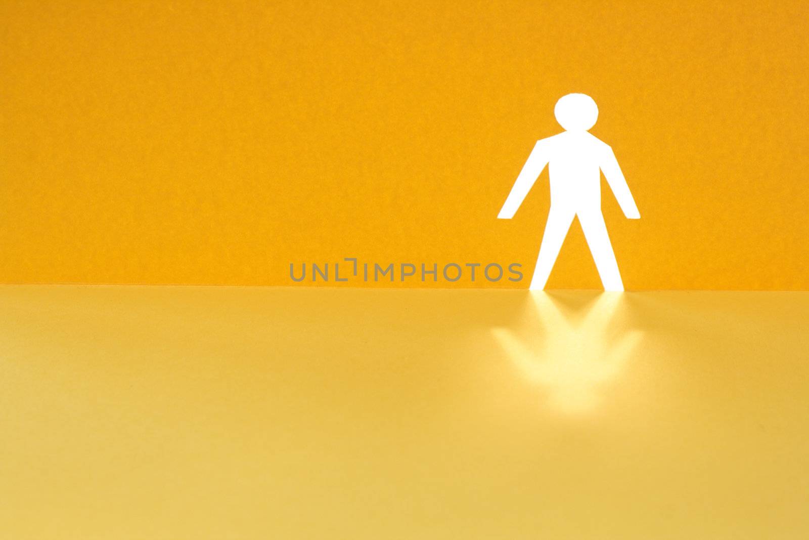 Abstrack background with man figure cutting from yellow paper