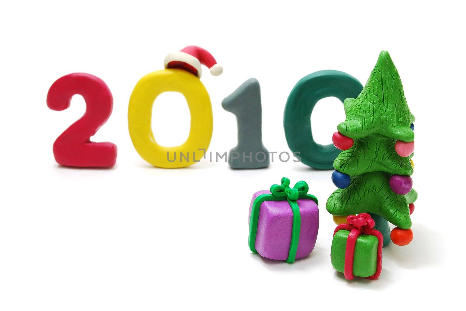 3D New Year Text 2010 Made of Colored Plasticine with Gifts and Christmas Tree Isolated on White Background