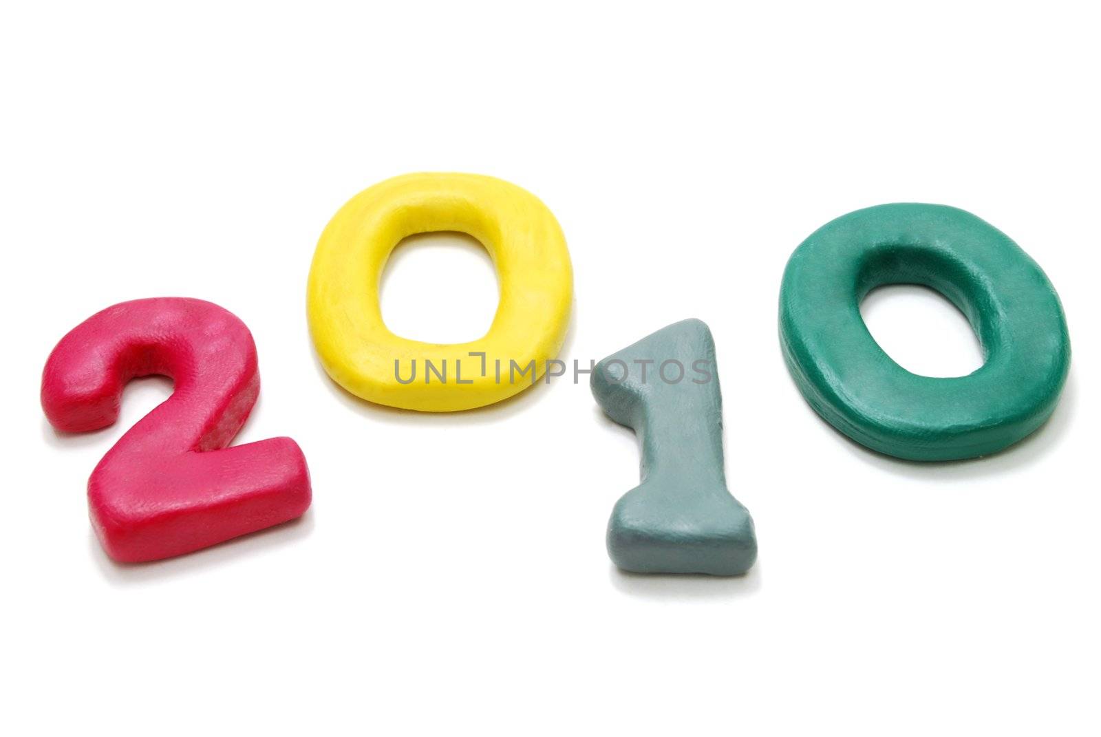 3D New Year Text 2010 Laying Random Made of Colored Plasticine Isolated on White Background