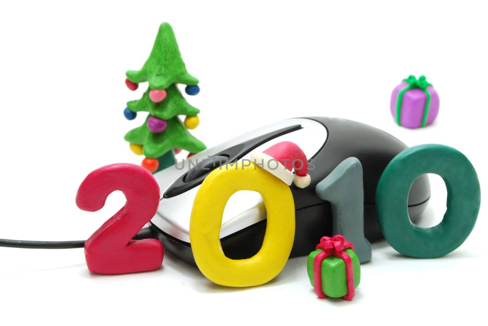 3D New Year Text 2010 with Christmas Tree and Gifts Made of Colored Plasticine and Computer Mouse Isolated on White Background