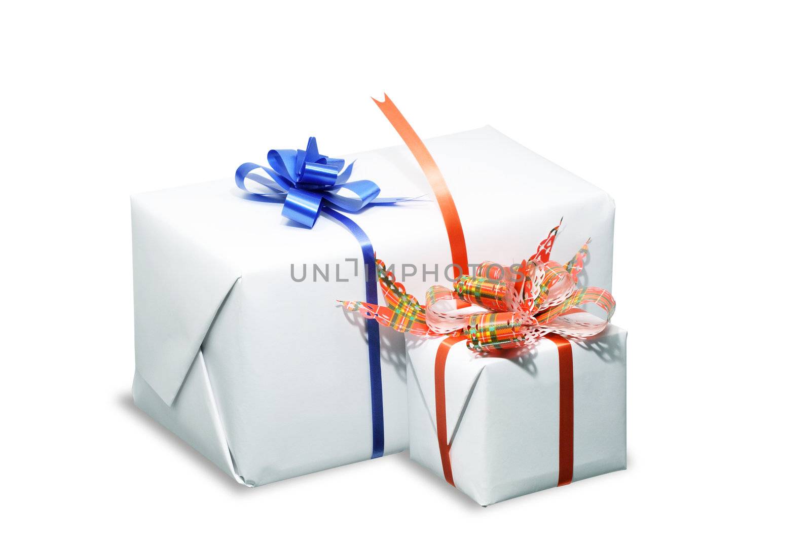 Two white boxes tied with a colored ribbon bows. Isolated on white with clipping path