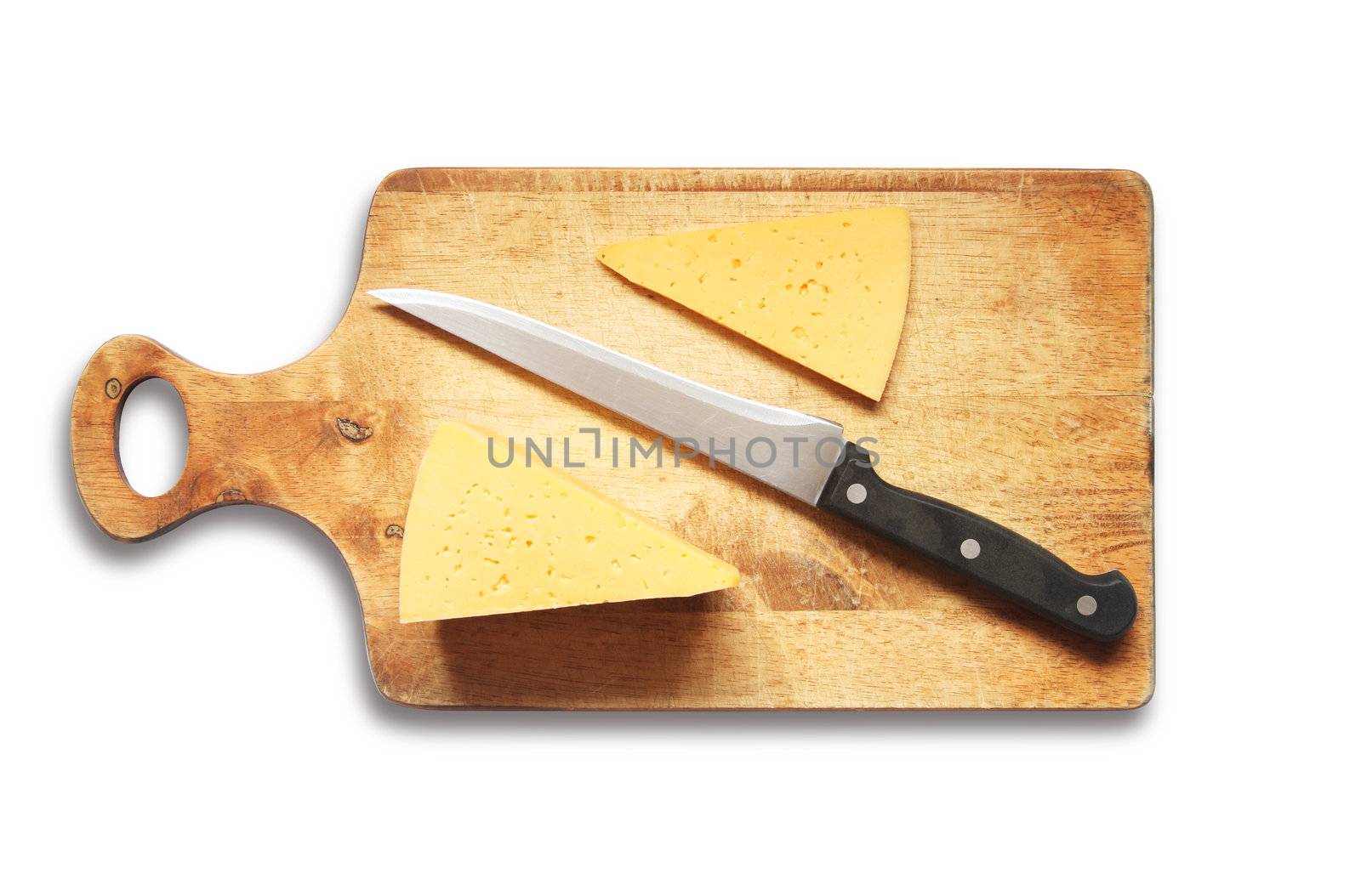 Sliced cheese and kitchen knife on wooden breadboard. Isolated with clipping path