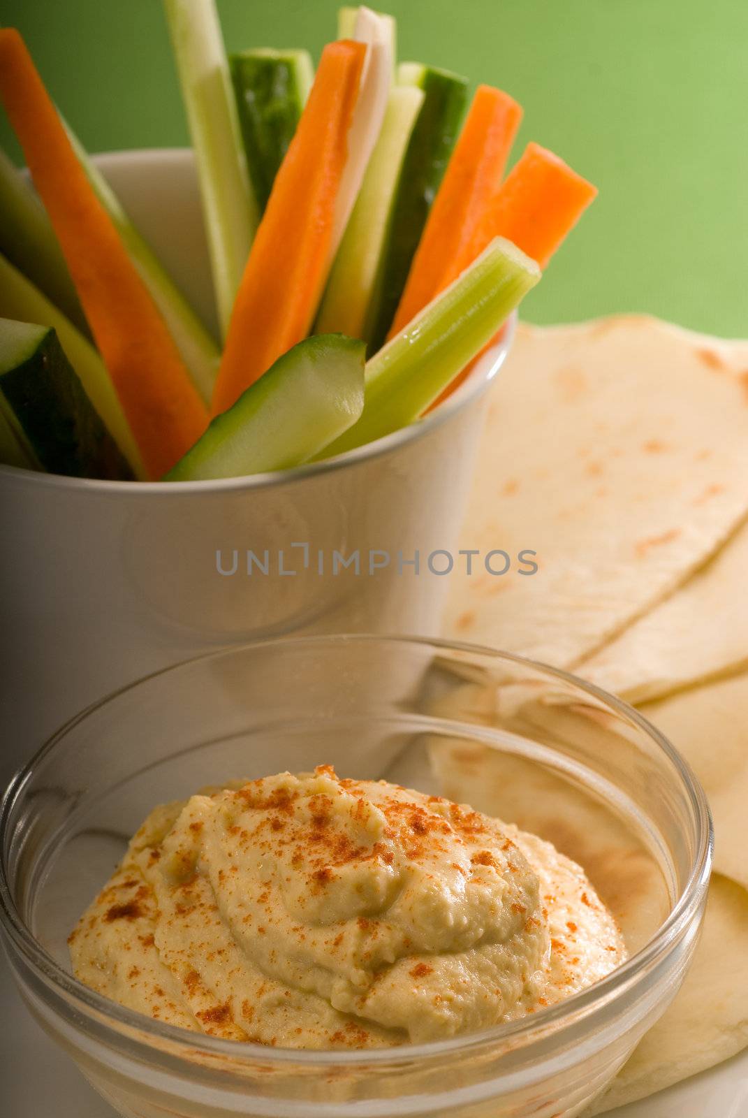 hummus dip with pita bread and vegetable by keko64