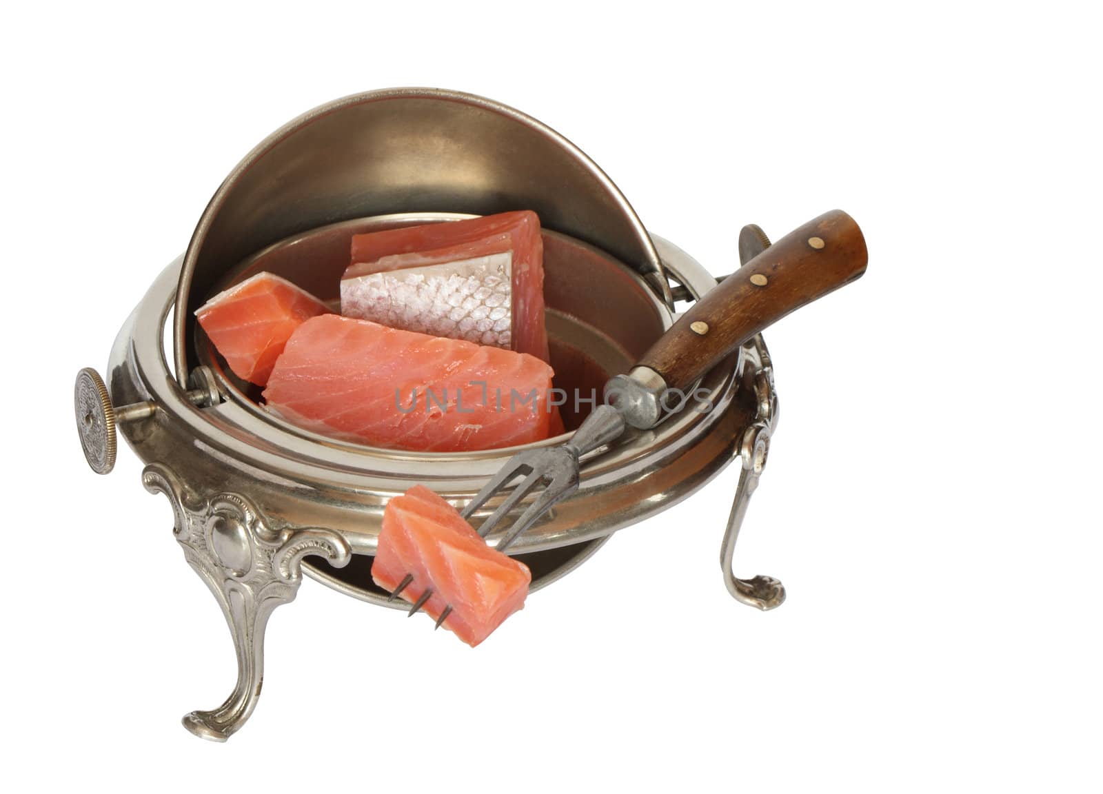 Few slices of salmon inside vintage metal dishware and old fork. Isolated on white background with clipping path