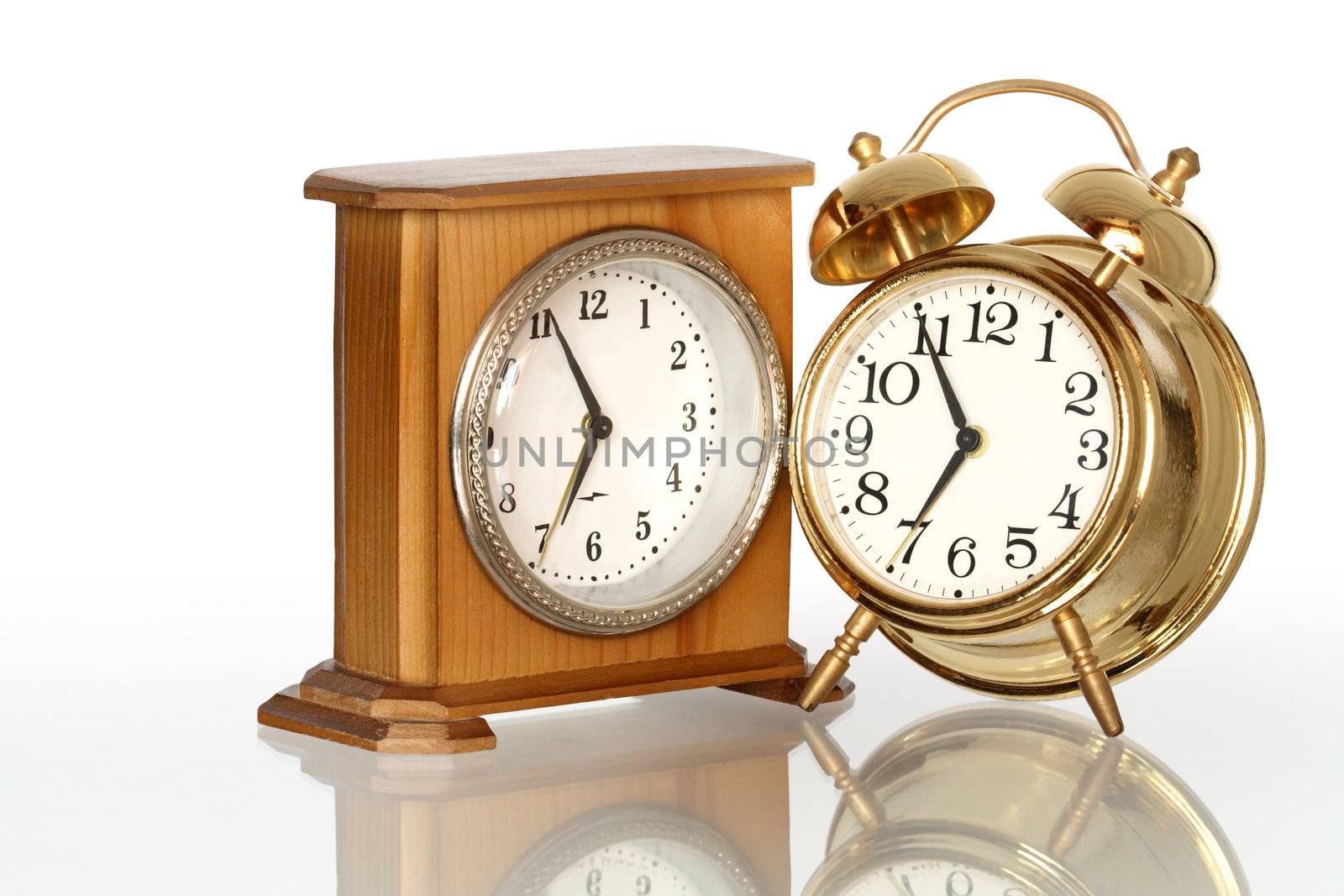Two alarm clocks isolated on white background with clipping path