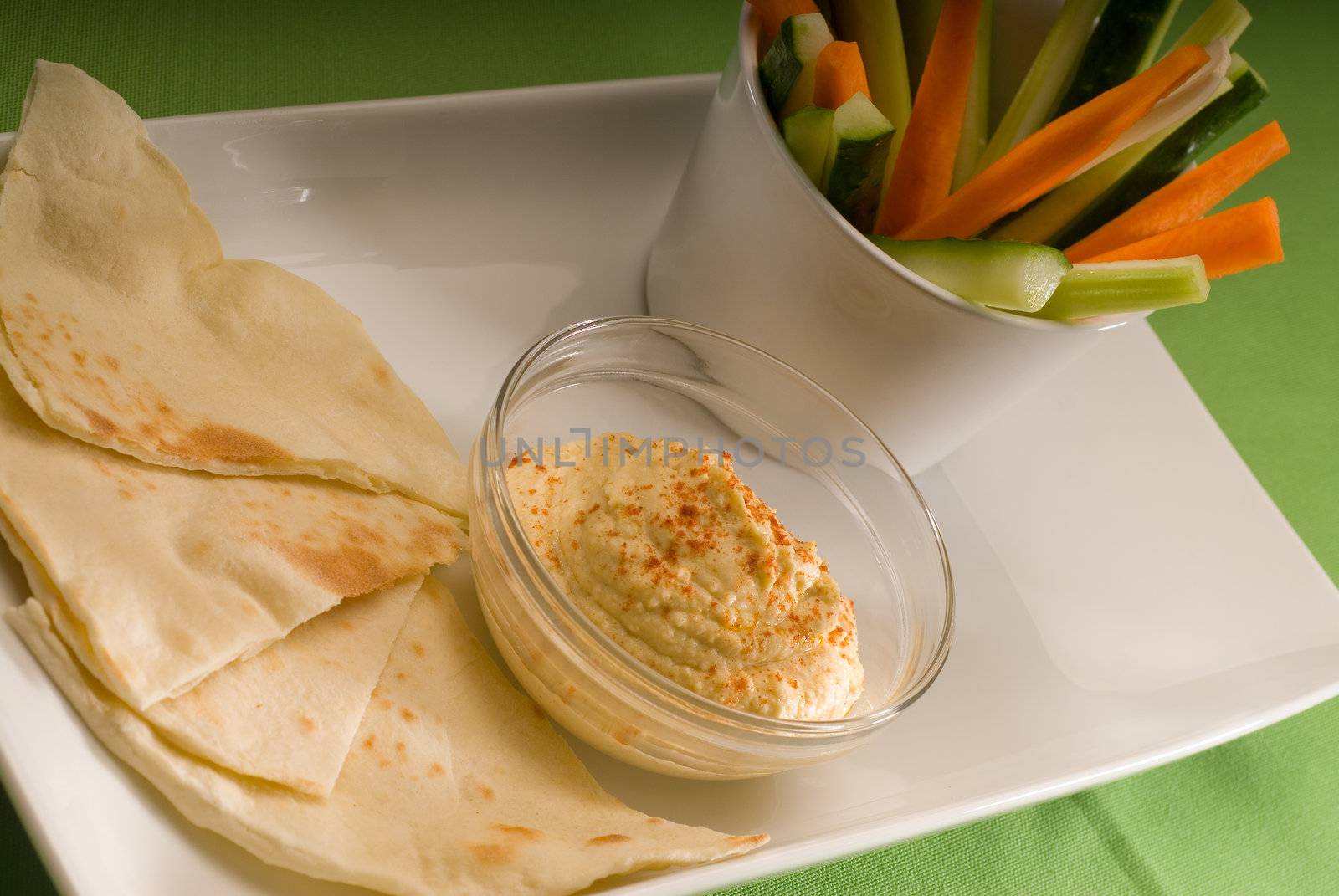 hummus dip with pita bread and vegetable by keko64