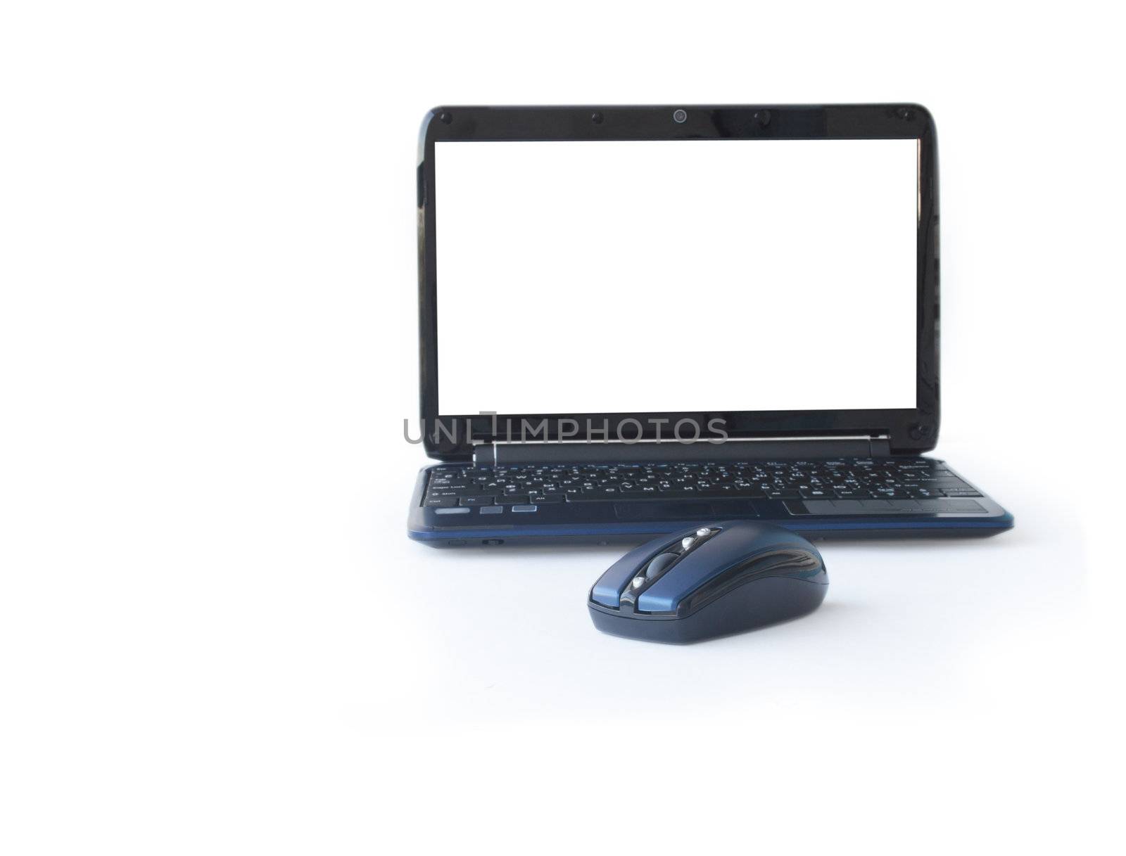 Computer mouse near modern laptop with blank isolated screen for your images