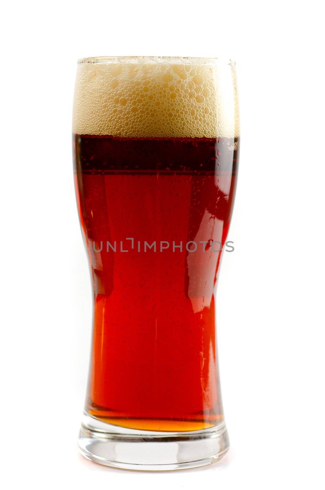 Glass of dark beer isolated on a white background