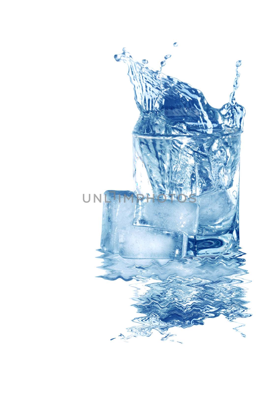 Ice cubes near glass of splashing water isolated on white with clipping path