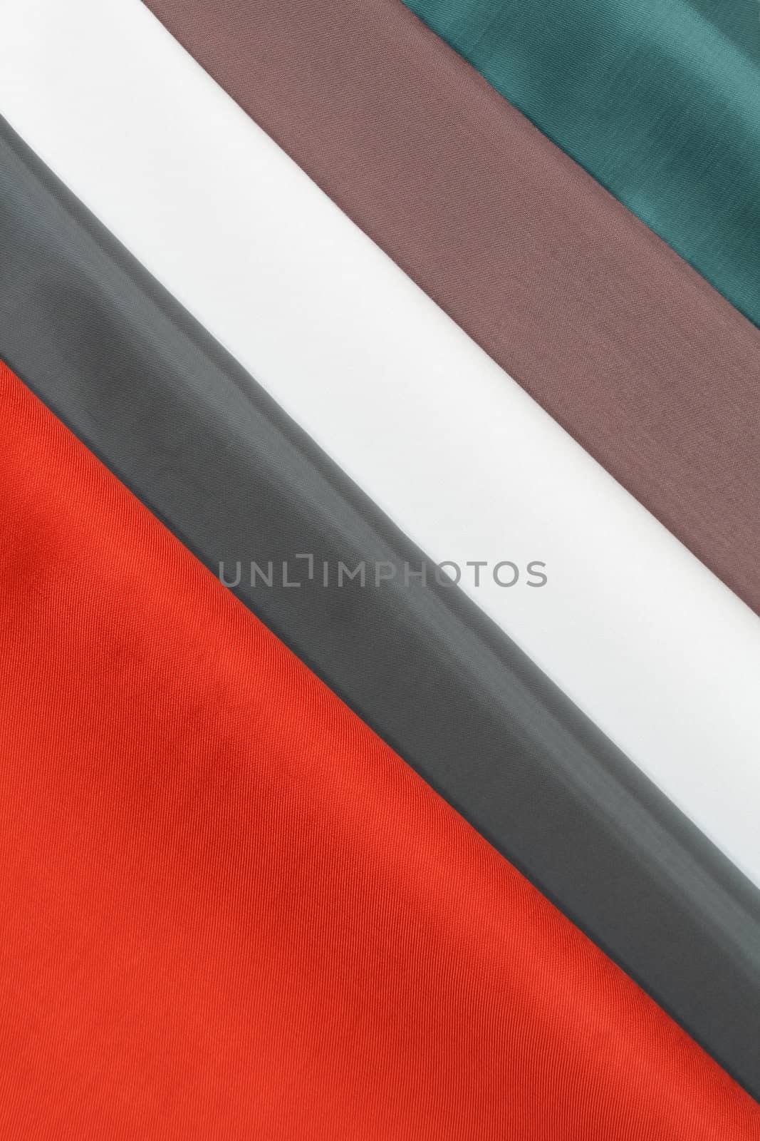 Background made from stack of various colored cloth