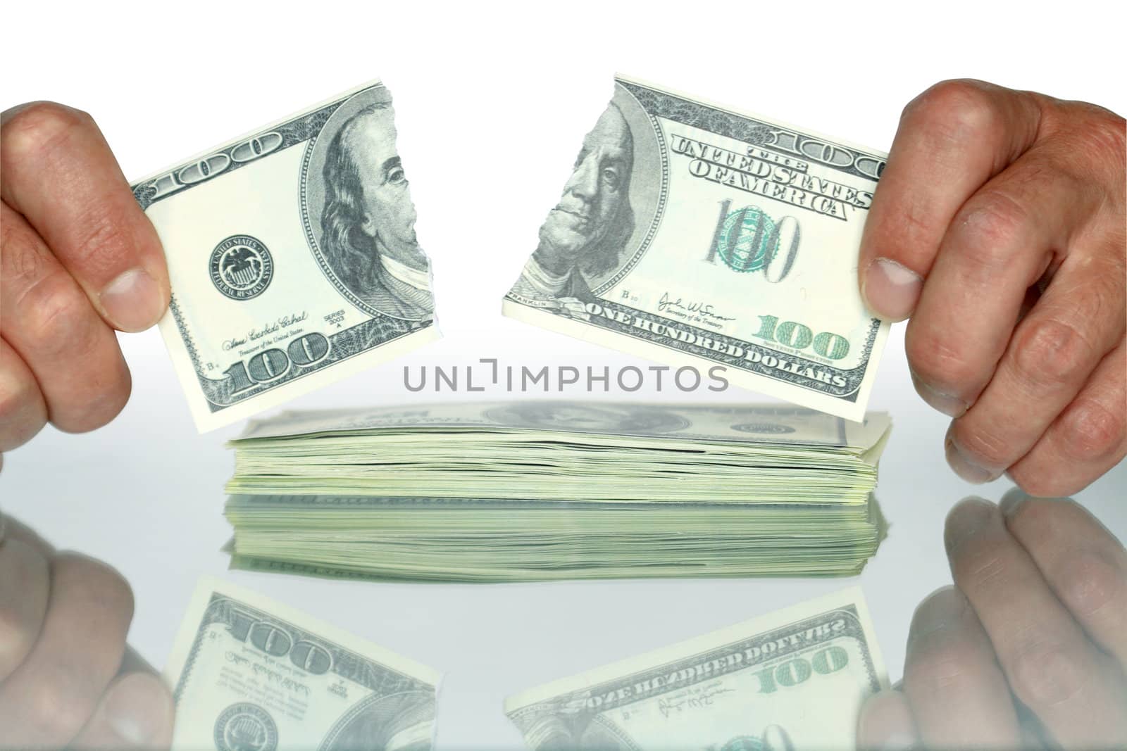 Human hands holding disrupt one hundred dollars banknote. Isolated with clipping path